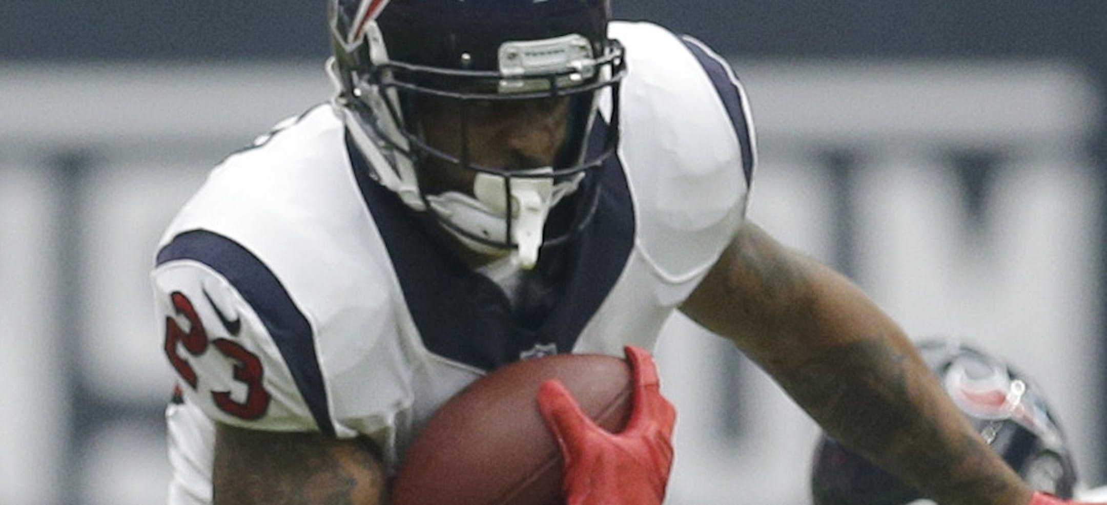 Houston Texans' Arian Foster (23) runs around Washington Redskins' Ryan Clark (25) during the first quarter of an NFL football game Sunday, Sept. 7, 2014, in Houston. (AP Photo/David J. Phillip)
