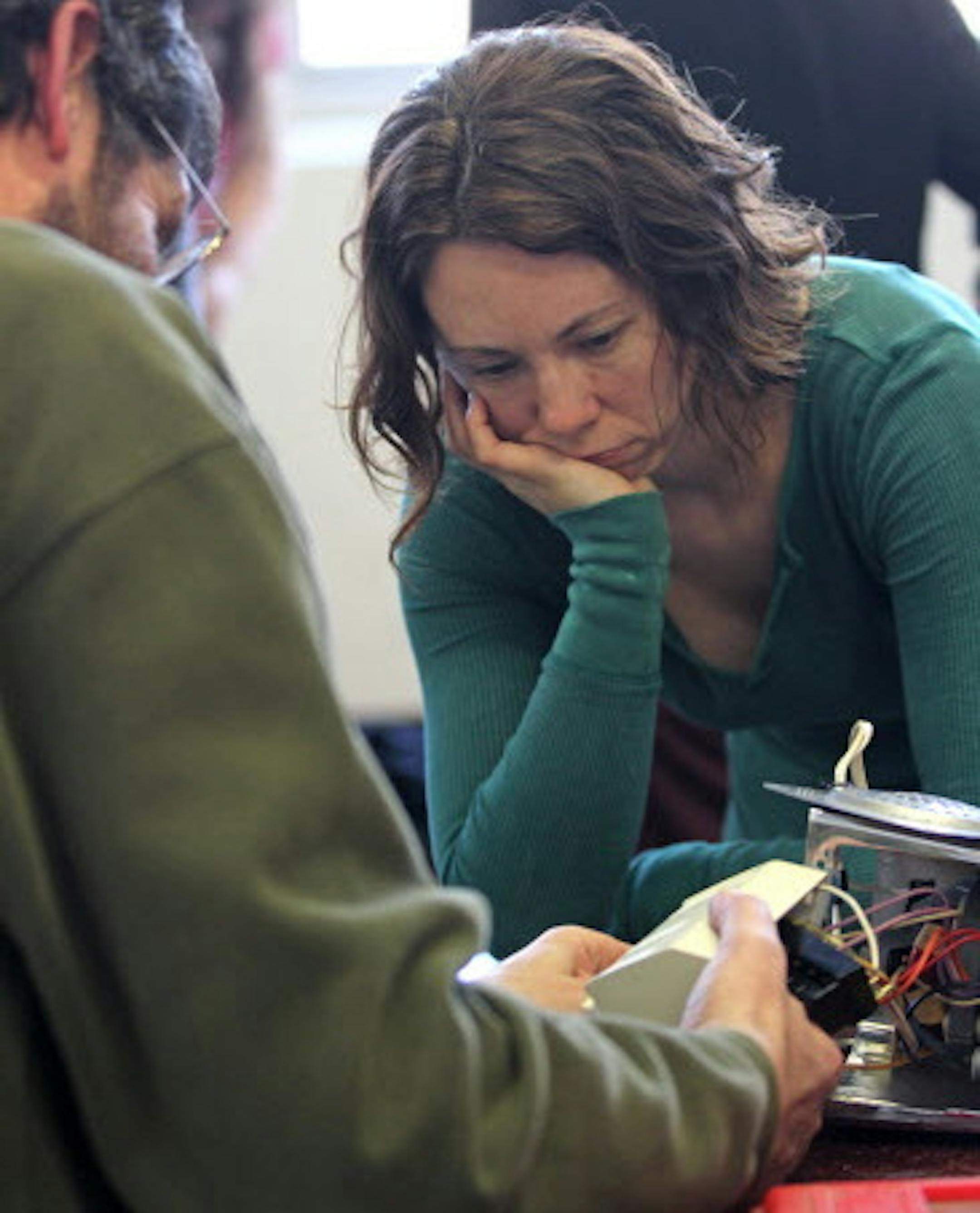 (left to right) Jorge Grauvilardell helped Karen Grimm fix her blender during the Hennepin County Fix-It Clinics where residents bring in small household appliances, electronics, clothing and mobile devices for repair. The Fix-It Clinic as held at The Mill, a workshop in north Minneapolis on 12/8/12.] Bruce Bisping/Star Tribune bbisping@startribune.com Jorge Grauvilardell, Karen Grimm/source