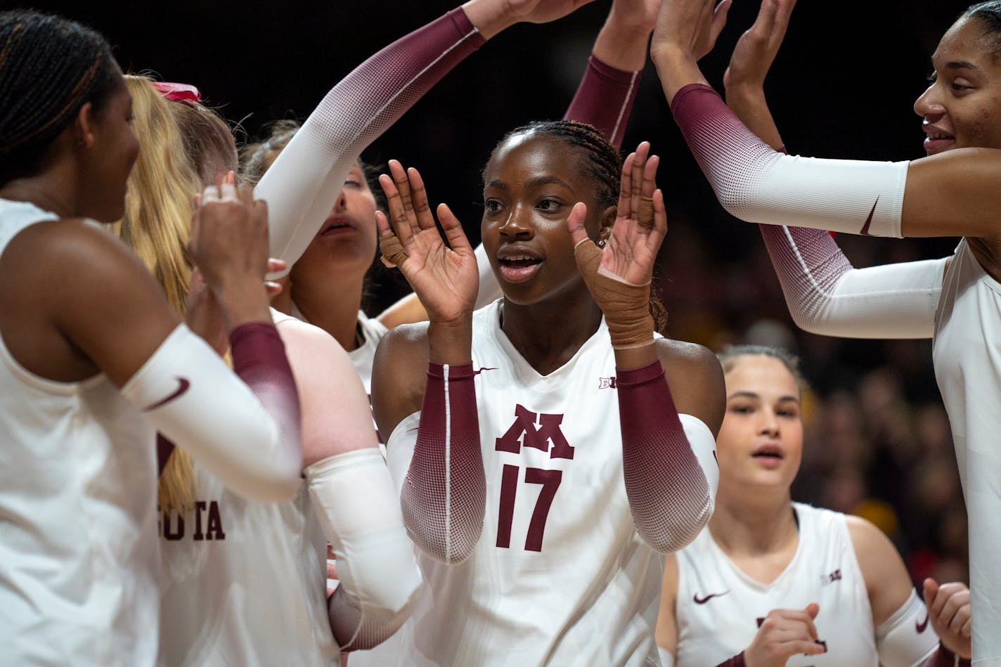 Minnesota players give each other support at the volleyball game at the Maturi Pavilion in Minneapolis on Saturday, Nov. 25, 2023. ] Angelina Katsanis • angelina.katsanis@startribune.com