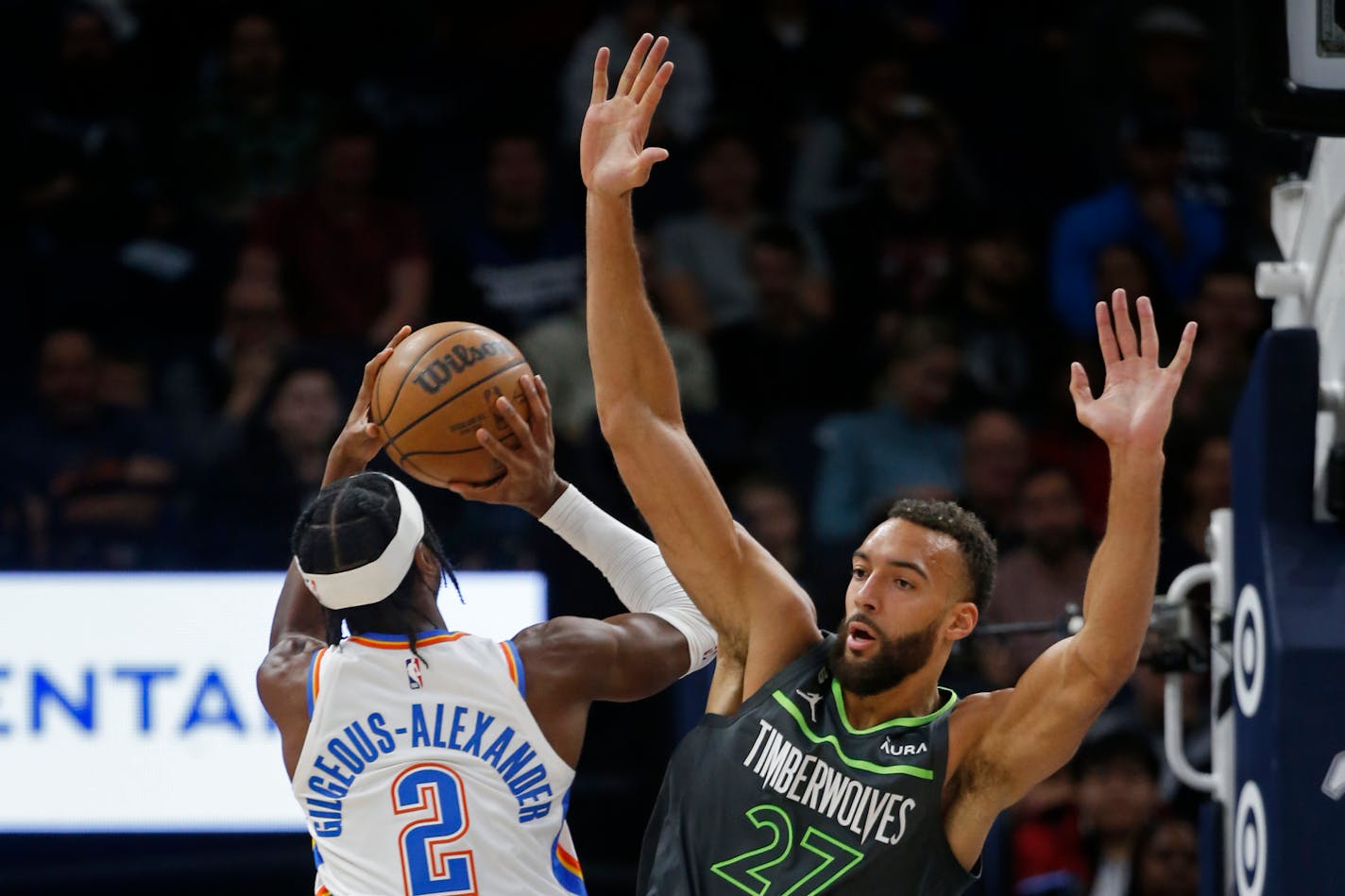 Oklahoma City guard Shai Gilgeous-Alexander shoots as Timberwolves center Rudy Gobert defends Saturday night.