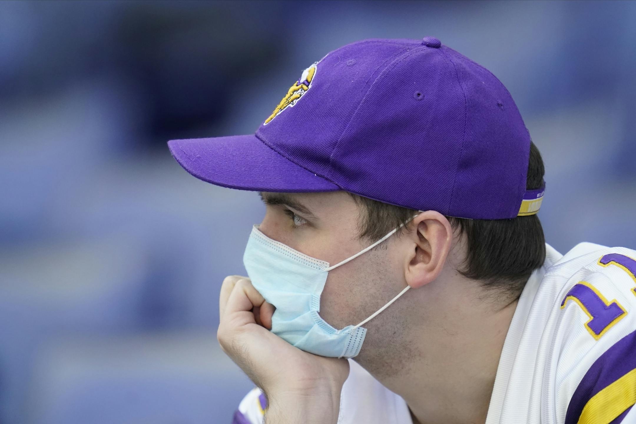 A Minnesota Vikings fan watches during the second half of an NFL football game between the Indianapolis Colts and the Minnesota Vikings, Sunday, Sept. 20, 2020, in Indianapolis.