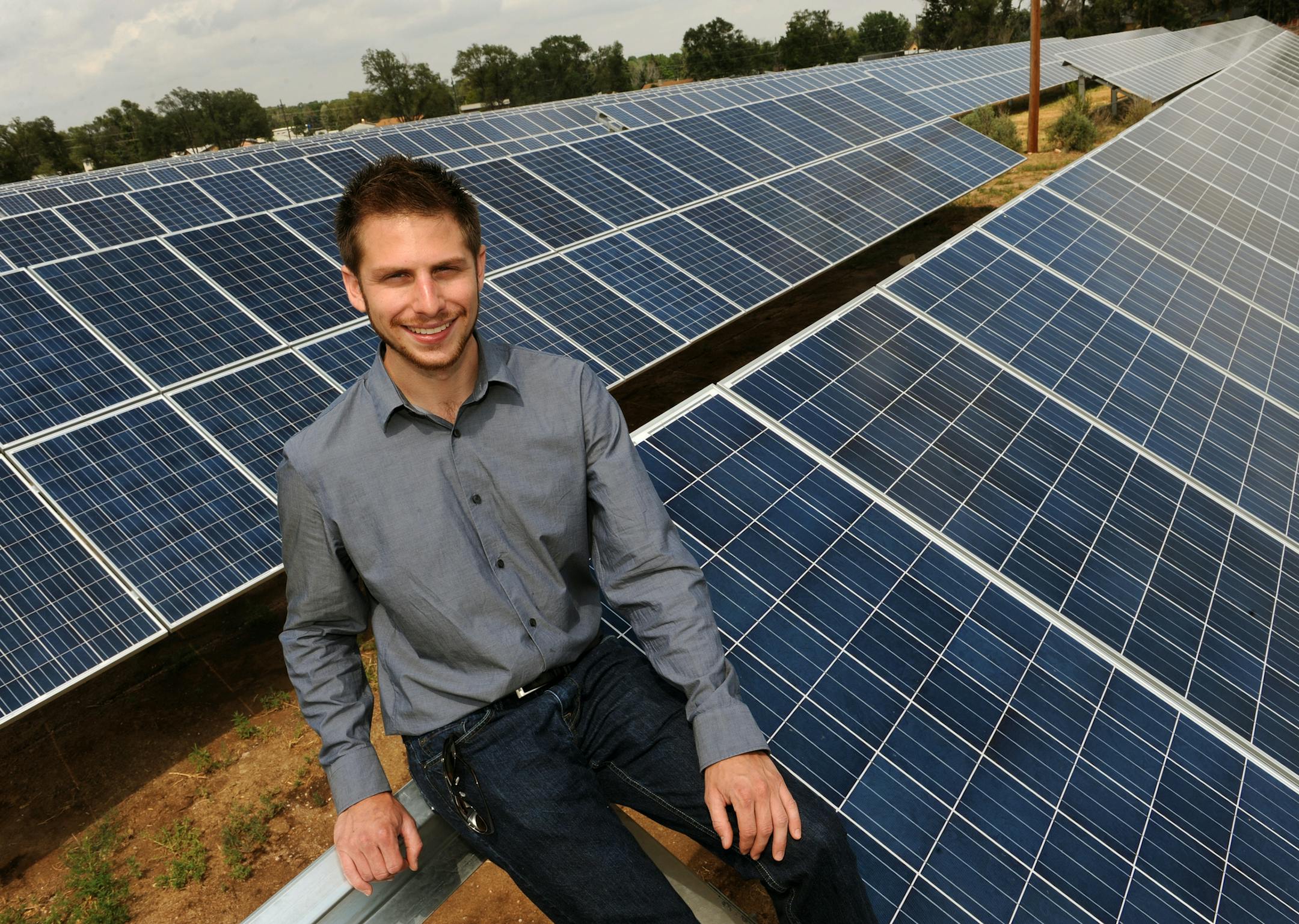 David Amster-Olszewski, CEO of SunShare, shows off some of the panels in his solar garden near 5354 South Highway 85/87 near Fountain, Colorado today July 10th, 2011. He offers solar panel energy to those that can't afford it but want alternative energy. People can buy shares in his panels and get solar credits through their utility company. Helen H. Richardson, The Denver Post (MANDATORY CREDIT. )
