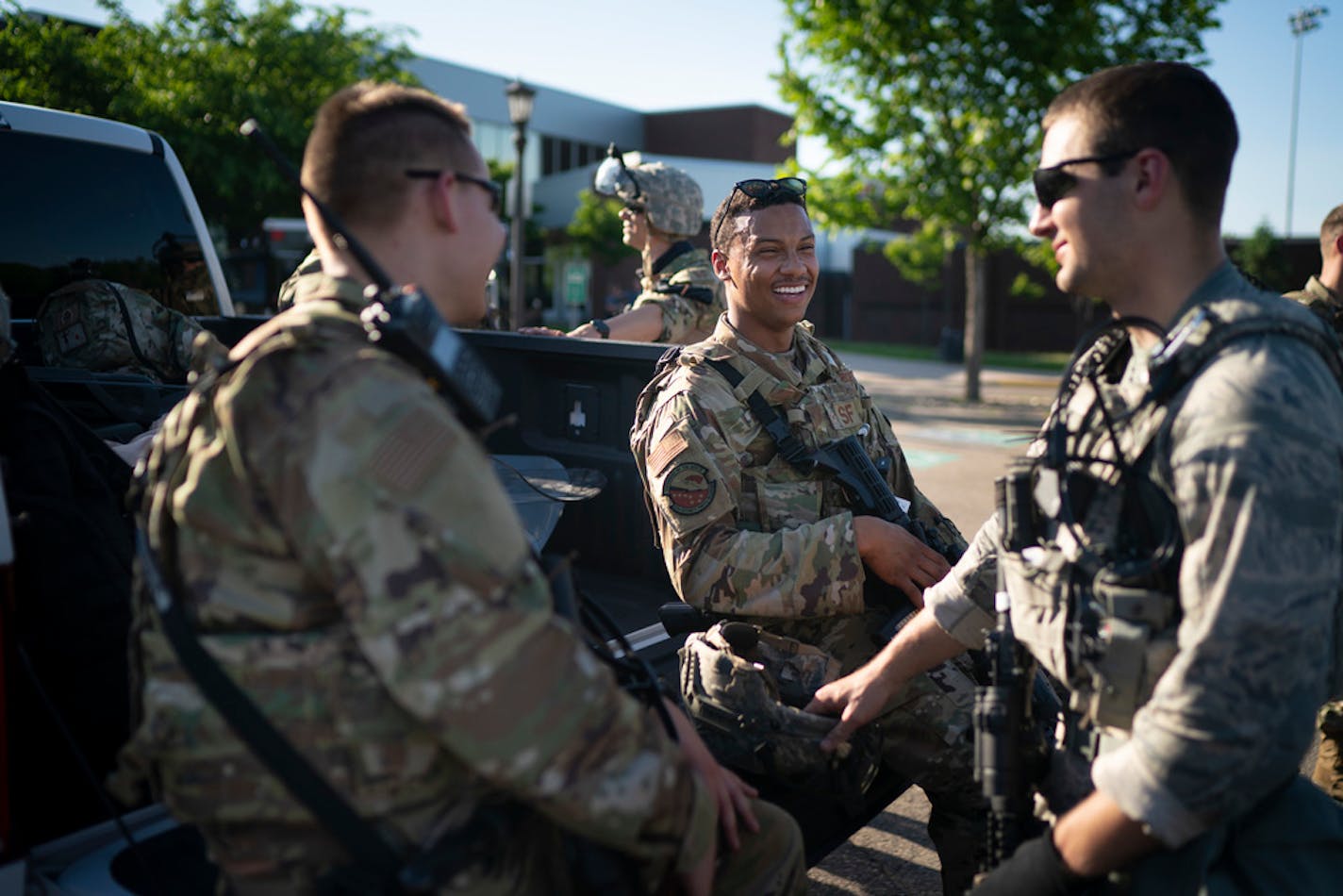 Airman 1st Class Jordan Hopwood, center, with other guardsmen as he awaited orders in St. Paul on Monday.