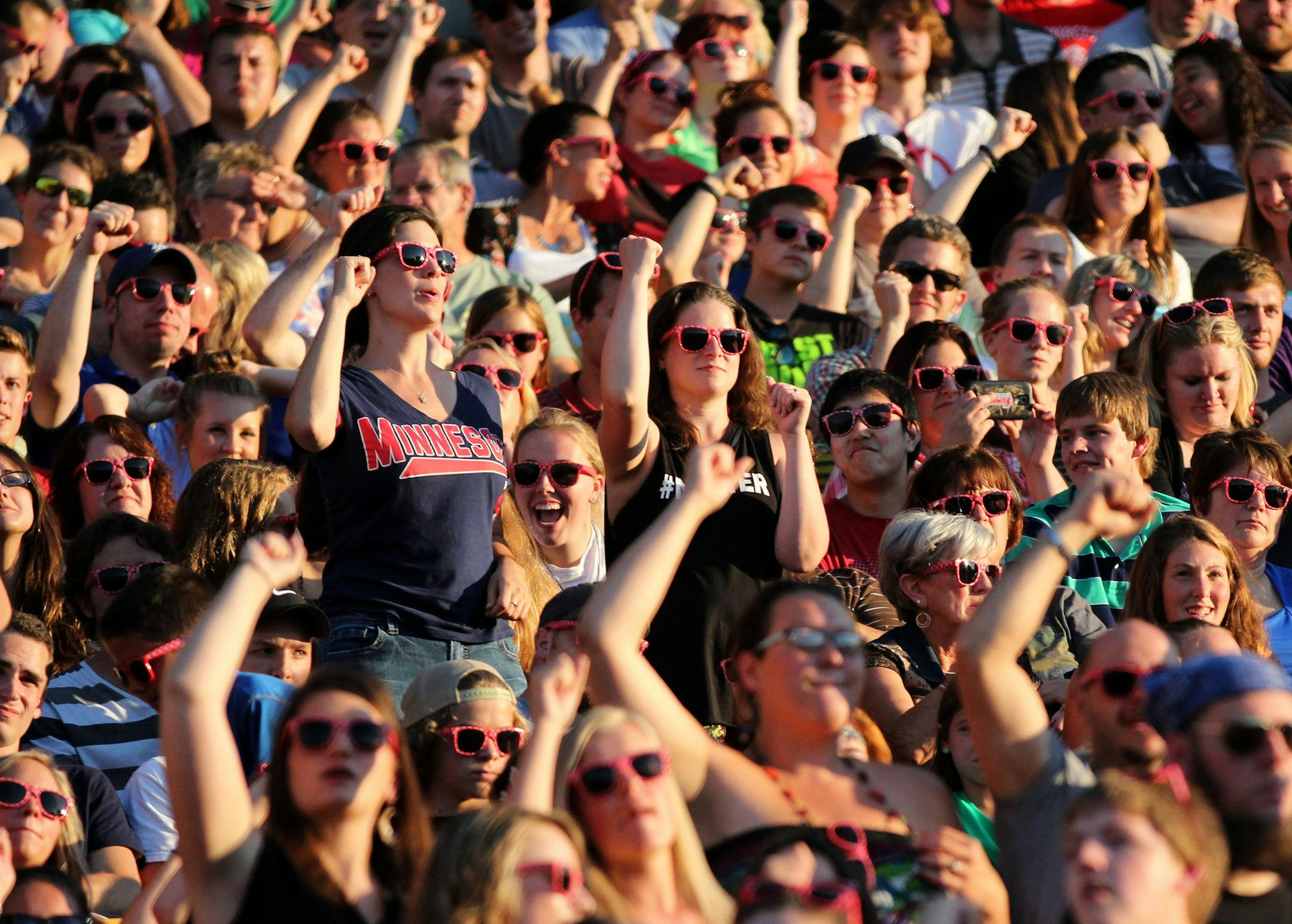 Fans dance during Atmosphere's performance during the All Star Concert on Saturday night at TCF Bank Stadium. ] MONICA HERNDON monica.herndon@startribune.com Minneapolis, MN 07/12/14