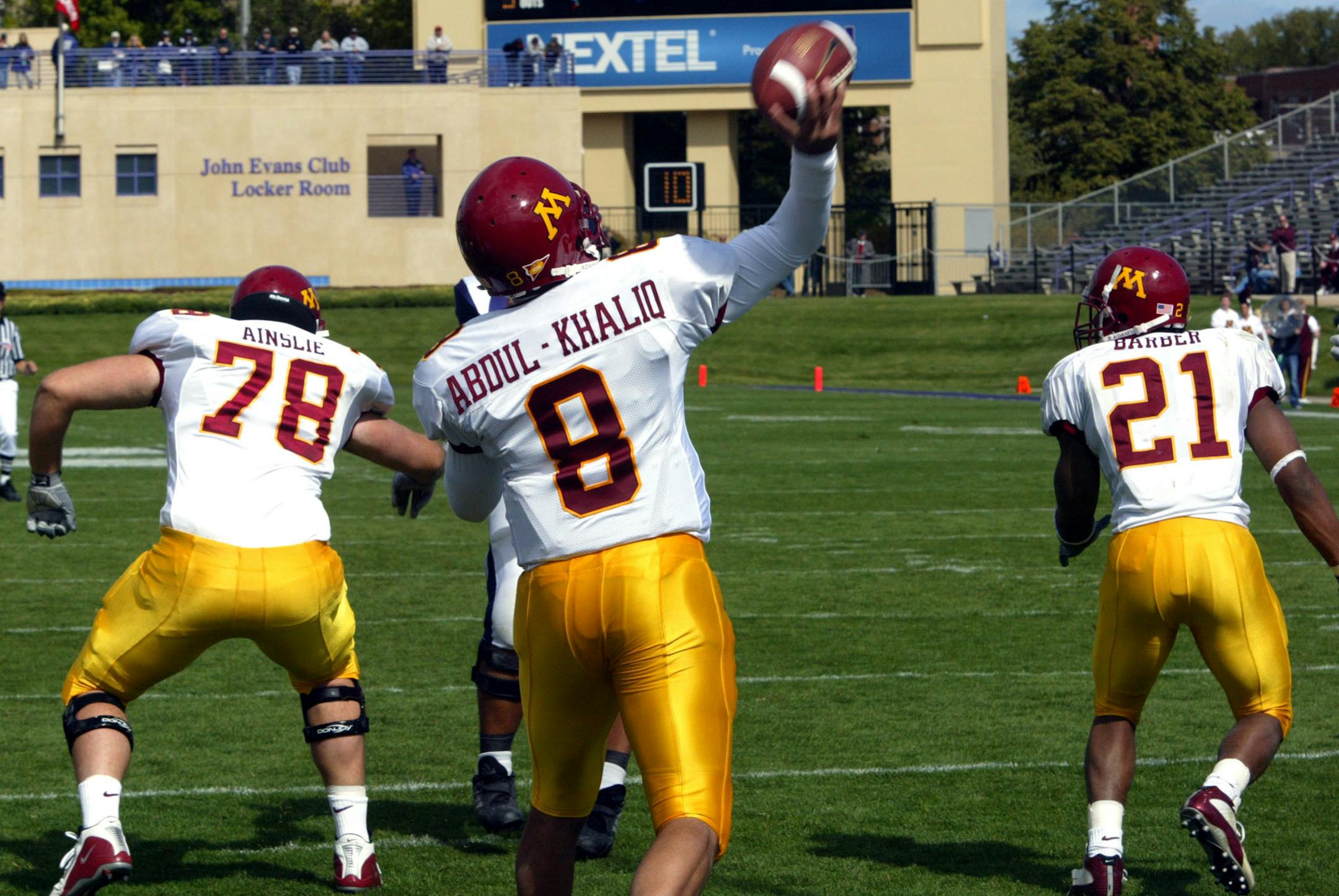 10/04/03 - University of Minnesota vs. Northwestern football -
IN THIS PHOTO: Gopher quarterback Asad Abdul-Khaliq unleashes a touchdown pass to Jared Ellerson for Minnesota's first score of the game making the score at the time 14-6. First half action.