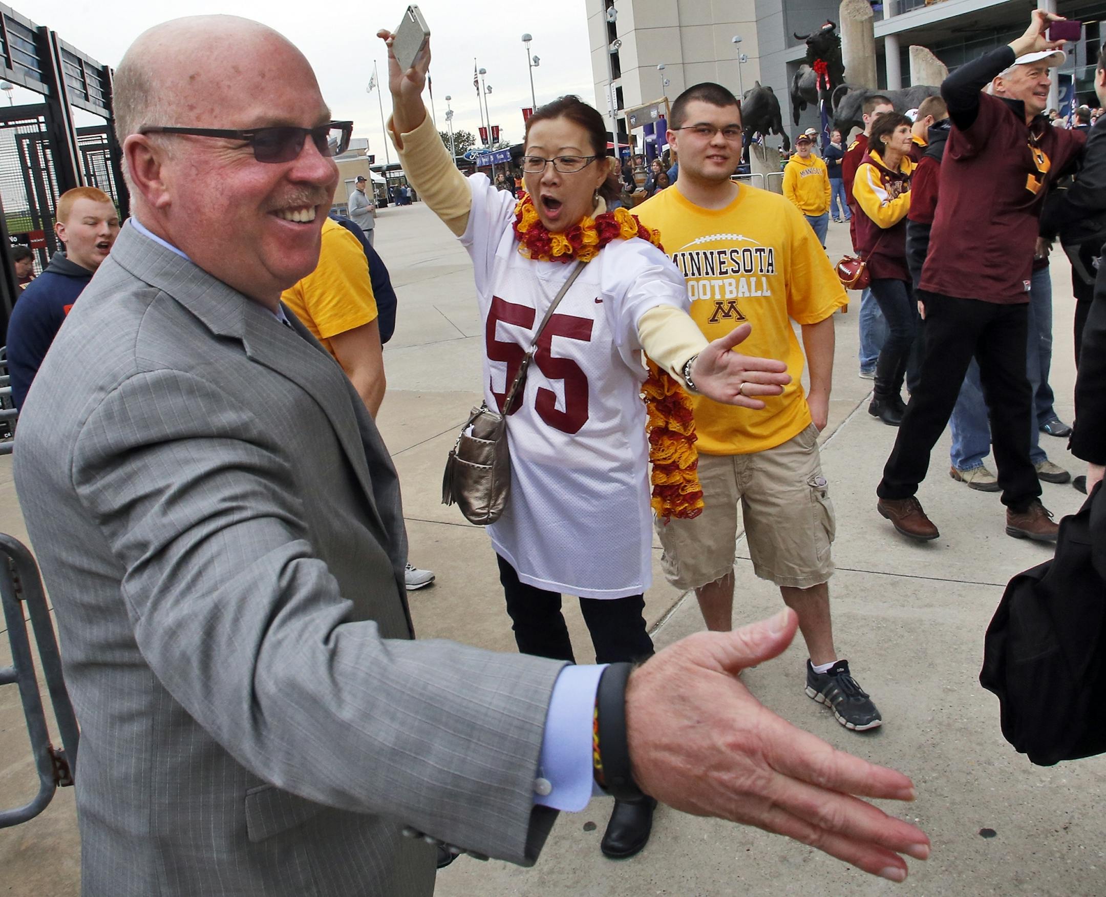 Minnesota Gophers vs. Syracuse Orange in Texas Bowl. Fans and band members whoop it up as the Gophers and head coach Jerry Kill make their way into Reliant Stadium. (MARLIN LEVISON/STARTRIBUNE