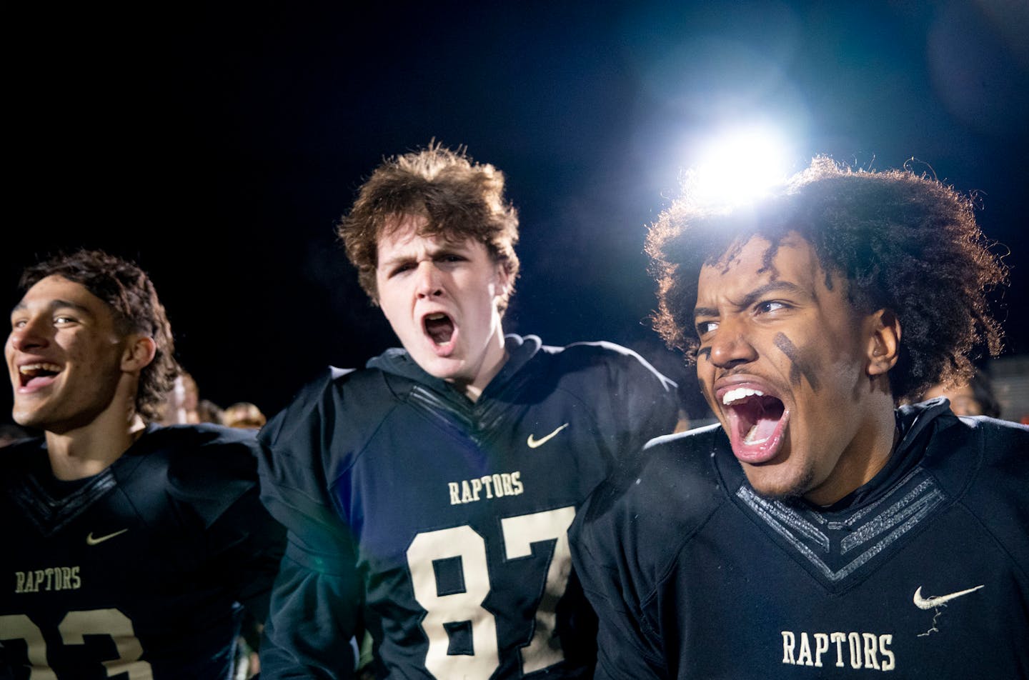 East Ridge players (left) Gavin Rothenberger, Hunter Groskopf and Michael Sobokssa celebrate after defeating Prior Lake. ]