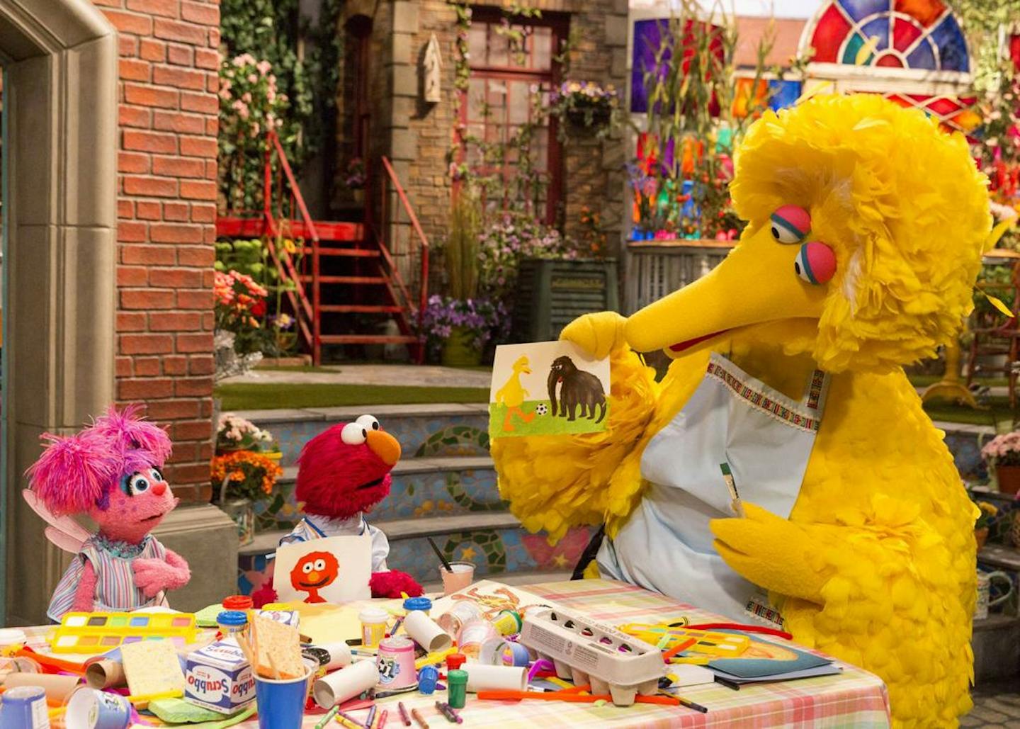 This image released by HBO shows characters, from left, Abby Cadabby, Elmo and Big Bird in a scene from "Sesame Street." The popular children's TV show is celebrating its 50th season.