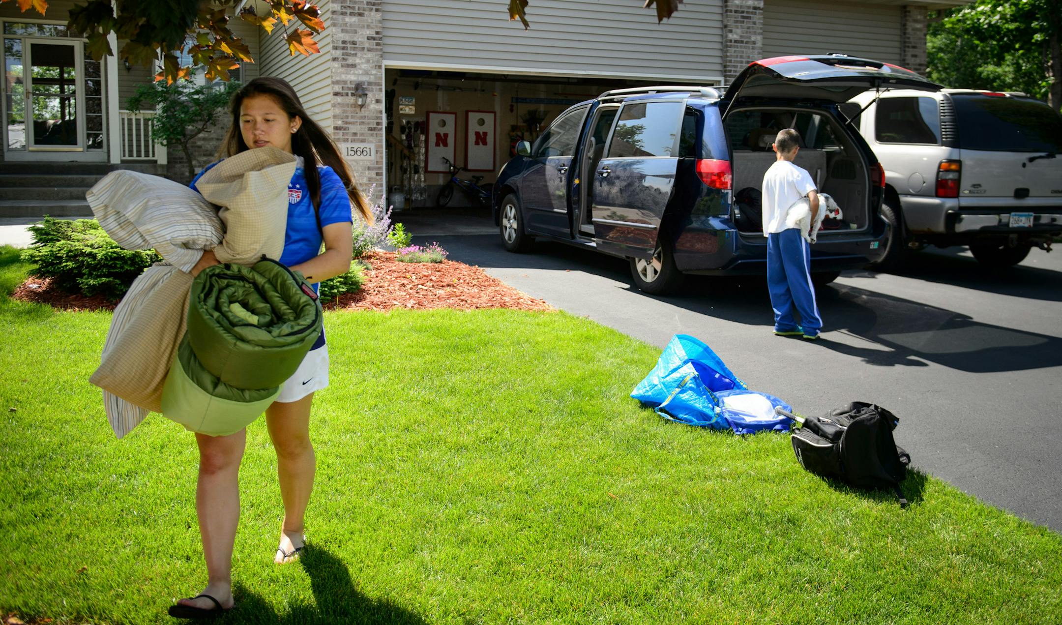 Maddy Griess carried her bedding to the RV. ] GLEN STUBBE * gstubbe@startribune.com Wednesday, June 10, 2015 Andover resident Tracey Griess packs her RV along with her family to go see the women's World Cup in Winnipeg. Griess, the head coach at Andover HS, was a Colorado College player herself, and her 17-year-old daughter Maddy is now a premier player for Centennial. They will take the family in the RV.