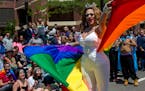 Onya Deek twirls with a cape during the annual Twin Cities Gay Pride Parade down Hennepin Avenue. ] COURTNEY PEDROZA &#x2022; courtney.pedroza@startri