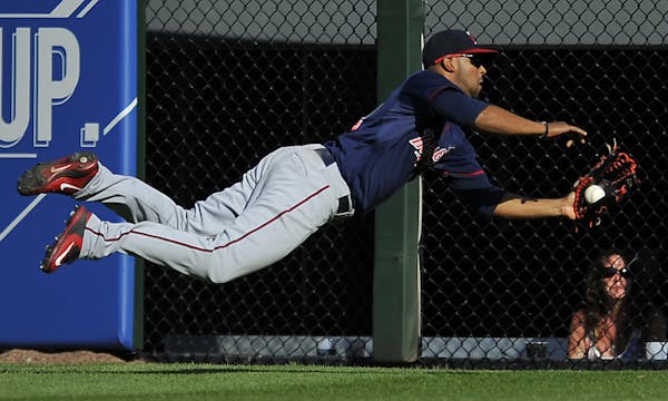 Minnesota Twins center fielder Aaron Hicks (32) catches a fly ball hit by Chicago White Sox's Adam Eaton during the eighth inning of a baseball game S