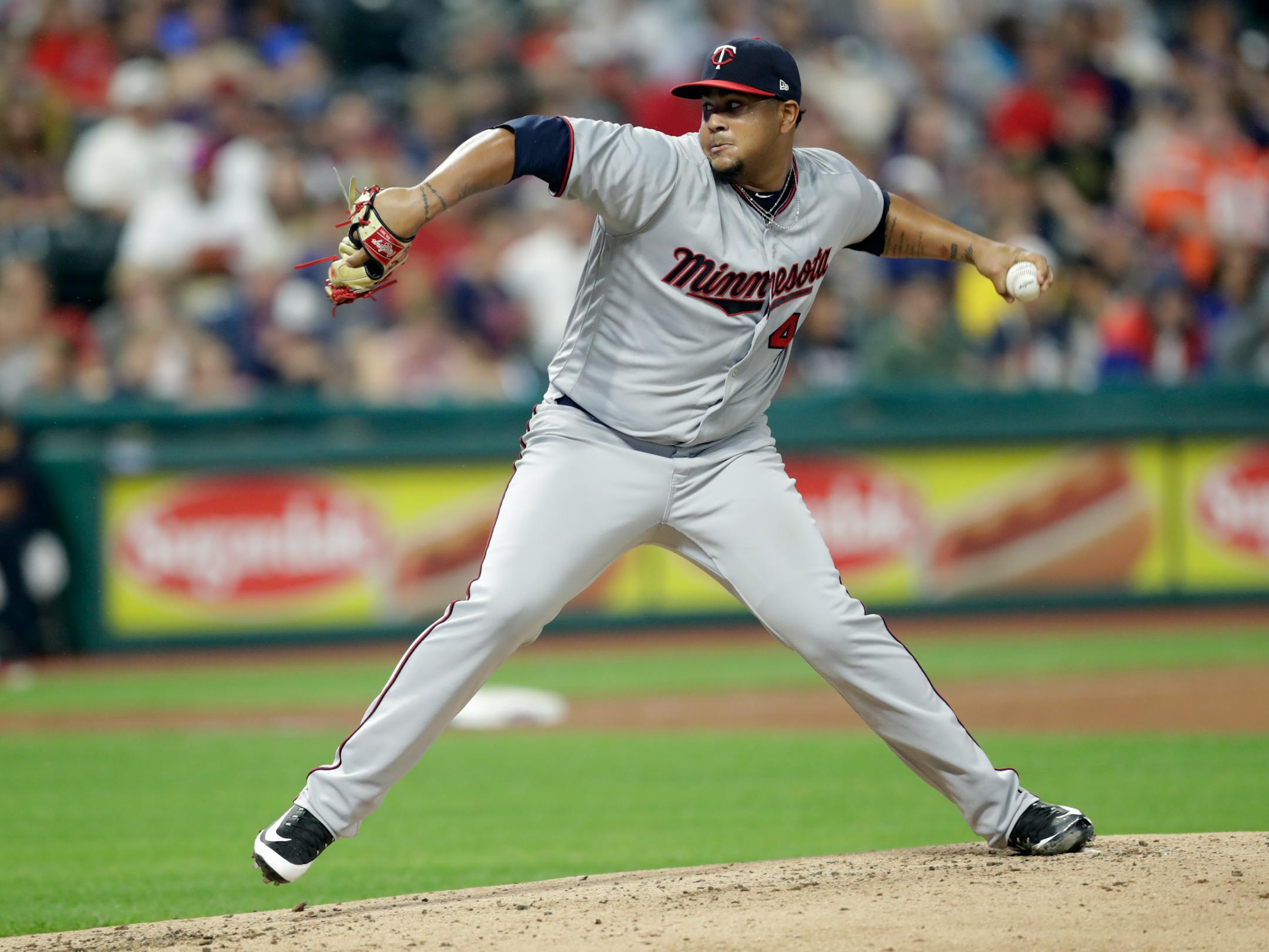 Minnesota Twins starter pitcher Adalberto Mejia delivers in the first inning of a baseball game against the Cleveland Indians, Tuesday, Aug. 7, 2018, in Cleveland. (AP Photo/Tony Dejak)