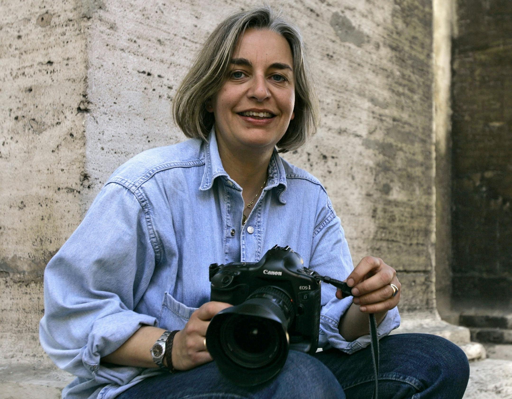 FILE - In this Thursday, April 2005 file photo, Associated Press photographer Anja Niedringhaus poses for a photograph in Rome. Niedringhaus, 48, was killed and an AP reporter was wounded on Friday, April 4, 2014, in Afghanistan.
