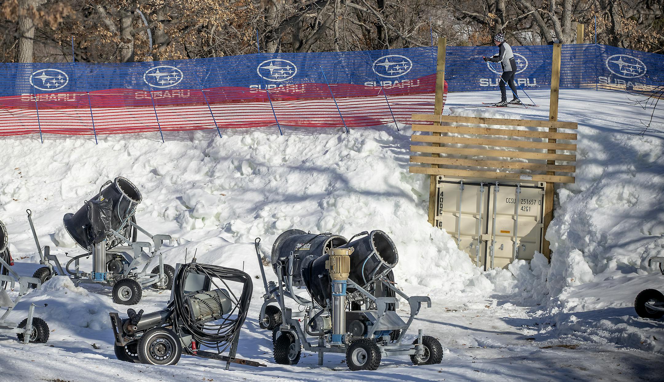 A skier made his way across a pile of snow and snow-making machines that is on reserve at Theodore Wirth Park, Friday, February 28, 2020 in Minneapolis, MN. The Loppet Foundation has been making and stockpiling snow since December for the World Cup cross-country ski race. ] ELIZABETH FLORES • liz.flores@startribune.com