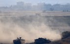 Israeli tanks take up positions along the border with the Gaza strip, on Israel-Gaza Border, Tuesday, May 29, 2018. The Israeli military said three so