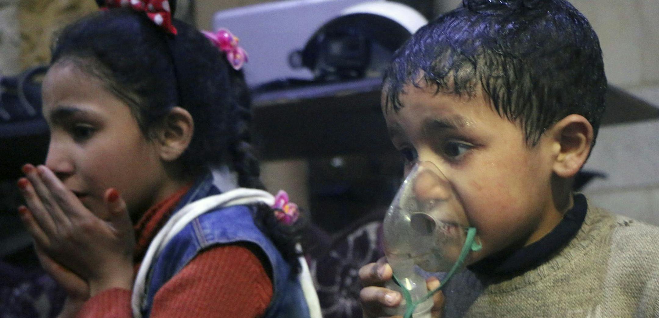 This image released early Sunday, April 8, 2018 by the Syrian Civil Defense White Helmets, shows a child receiving oxygen through respirators following an alleged poison gas attack in the rebel-held town of Douma, near Damascus, Syria. Syrian rescuers and medics said the attack on Douma killed at least 40 people. The Syrian government denied the allegations, which could not be independently verified. The alleged attack in Douma occurred Saturday night amid a resumed offensive by Syrian governmen