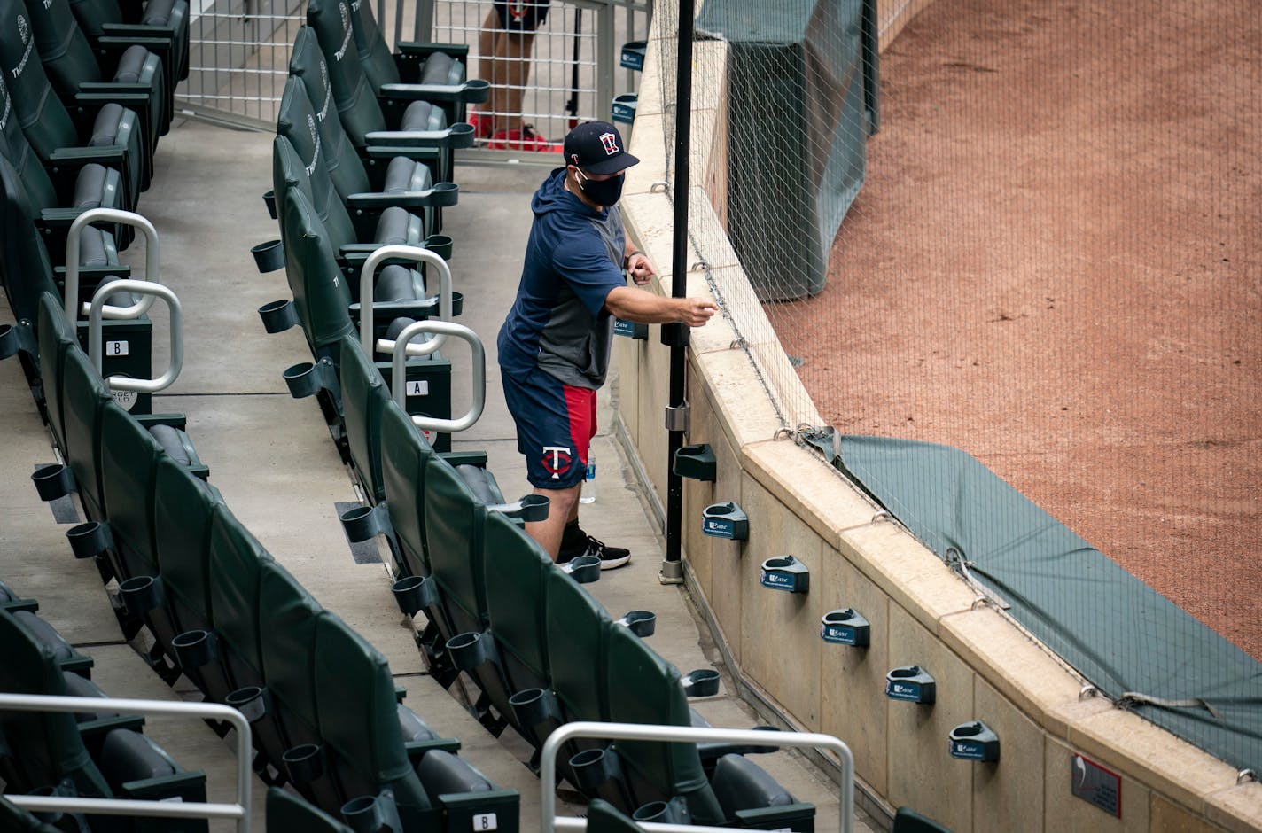 Twins advance scout Colby Suggs relayed a strike call from the automated umpire during Thursday's scrimmage.