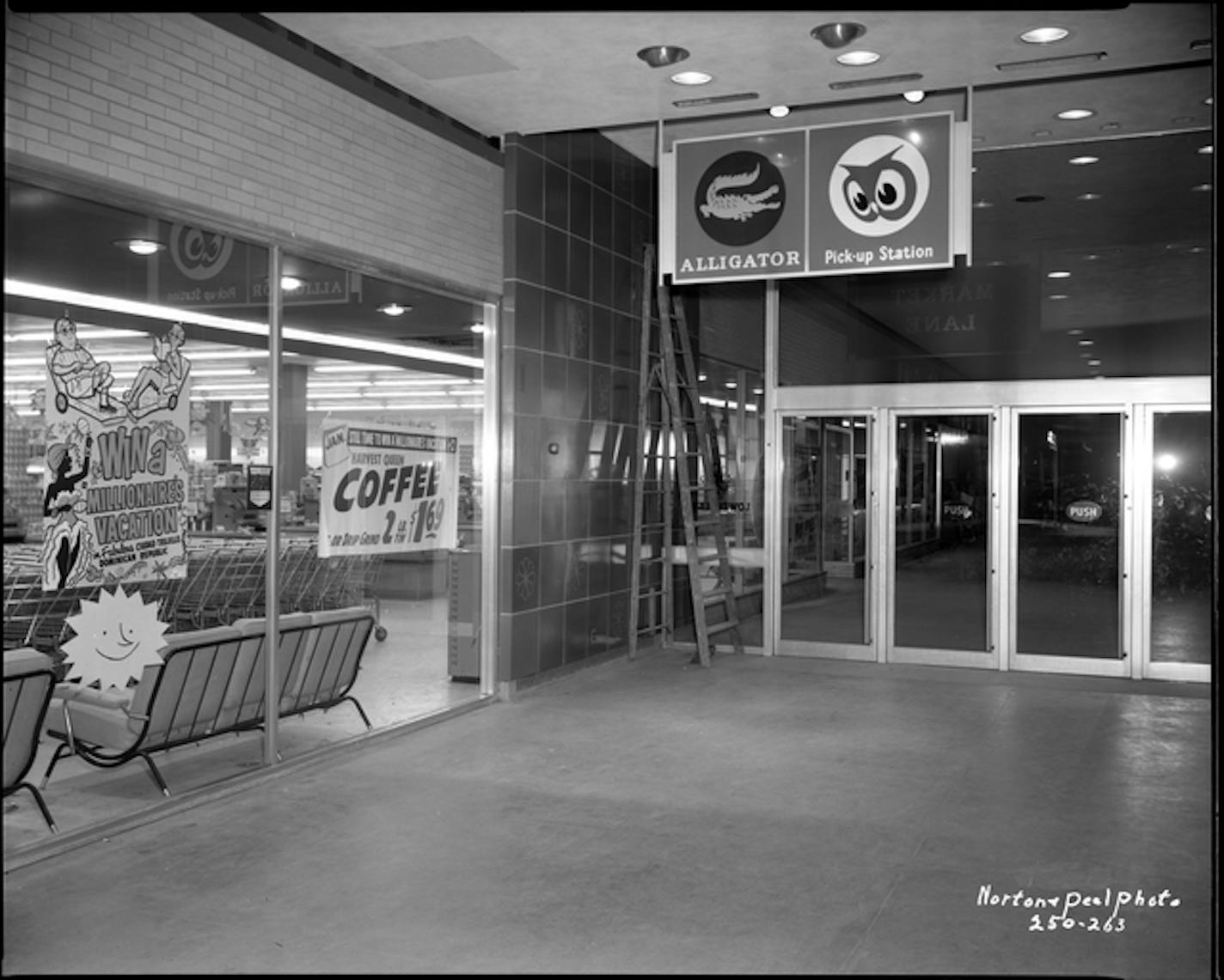 Signage at Southdale Center directing customers to Alligator parking lot and Red Owl pick-up station, Edina.