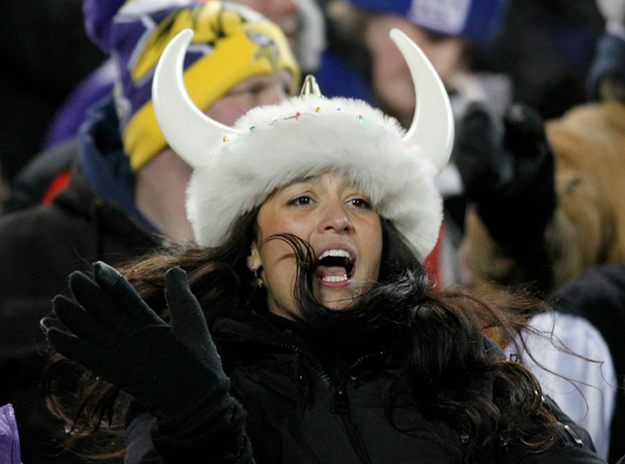 A Minnesota Vikings fan cheers during the second half of an NFL football game against the New York Giants, Sunday, Dec. 27, 2015, in Minneapolis. The Vikings won 49-17.