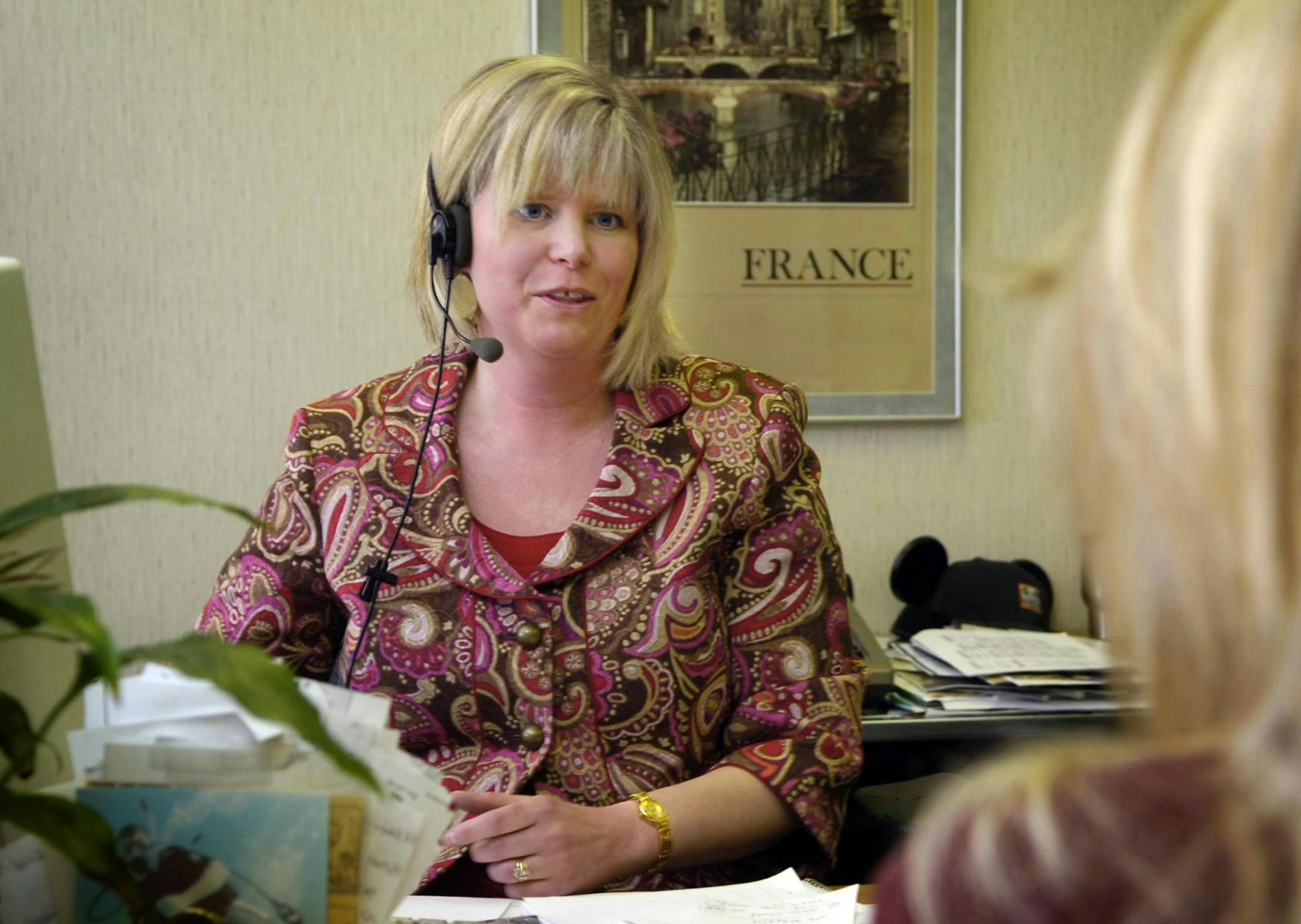 Travel Agent Deborah Gregory assists a client with travel plans on Monday, April 21, 2008, at Storer Travel Service in Modesto, California. (Bart Ah You/Modesto Bee/MCT)