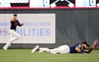 Minnesota Twins' Marwin Gonzalez catches a line drive for an out against Kansas City Royals' Billy Hamilton during the ninth inning of a baseball game