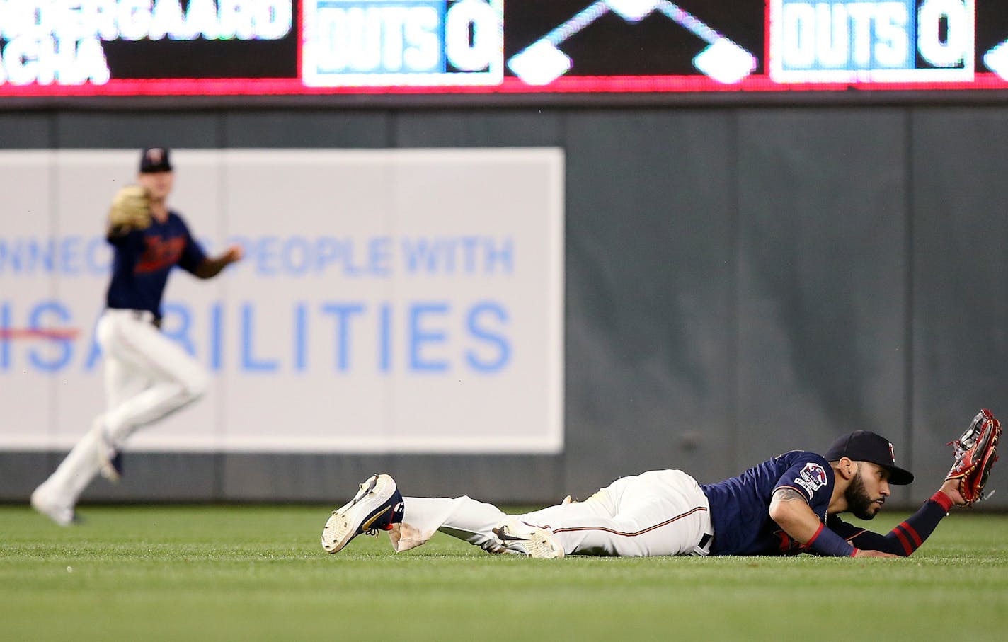 Minnesota Twins' Marwin Gonzalez catches a line drive for an out against Kansas City Royals' Billy Hamilton during the ninth inning of a baseball game Saturday, June 15, 2019, in Minneapolis. (AP Photo/Stacy Bengs)