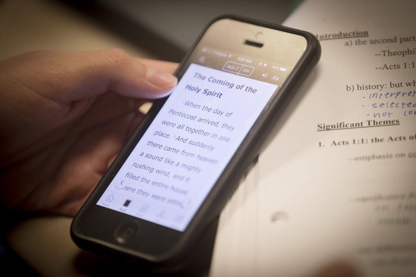 Bethel University students in Prof. Mike Holmes' "Introduction to Bible Studies" class use their cell phone bible apps to follow him while he uses a bible during a class, Wednesday, May 3, 2017 in Arden Hills, MN.