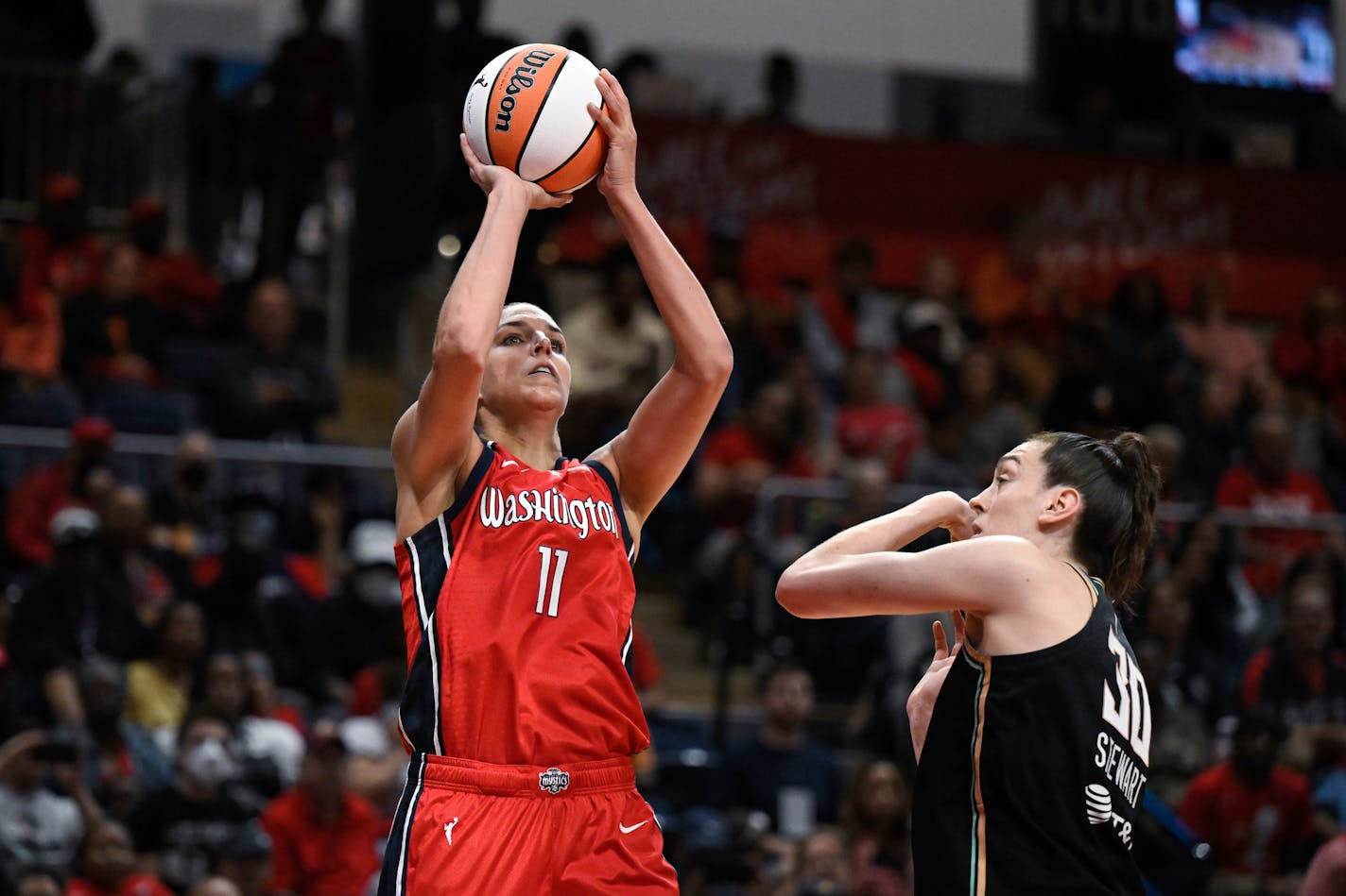 Washington Mystics forward Elena Delle Donne (11) shoots the ball against New York Liberty forward Breanna Stewart (30) during the second half of a WNBA basketball game, Friday, May 19, 2023, in Washington. (AP Photo/Terrance Williams)