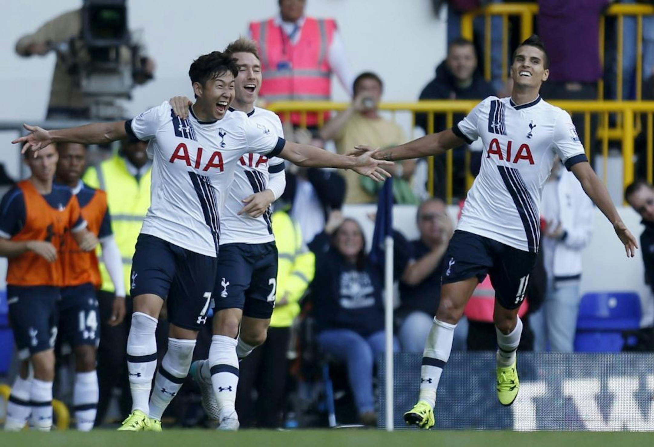 Tottenham Hotspur's Heung-Min Son, left, celebrates with Christian Eriksen and Erik Lamela, right, after scoring his side's first goal of the game against Crystal Palace during their English Premier League match at White Hart Lane, London, Sunday Sept. 20, 2015. (Paul Harding/PA via AP) UNITED KINGDOM OUT NO SALES NO ARCHIVE