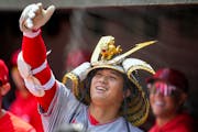 Los Angeles Angels designated hitter Shohei Ohtani celebrates in the dugout after hitting a home run against the Baltimore Orioles during the first in