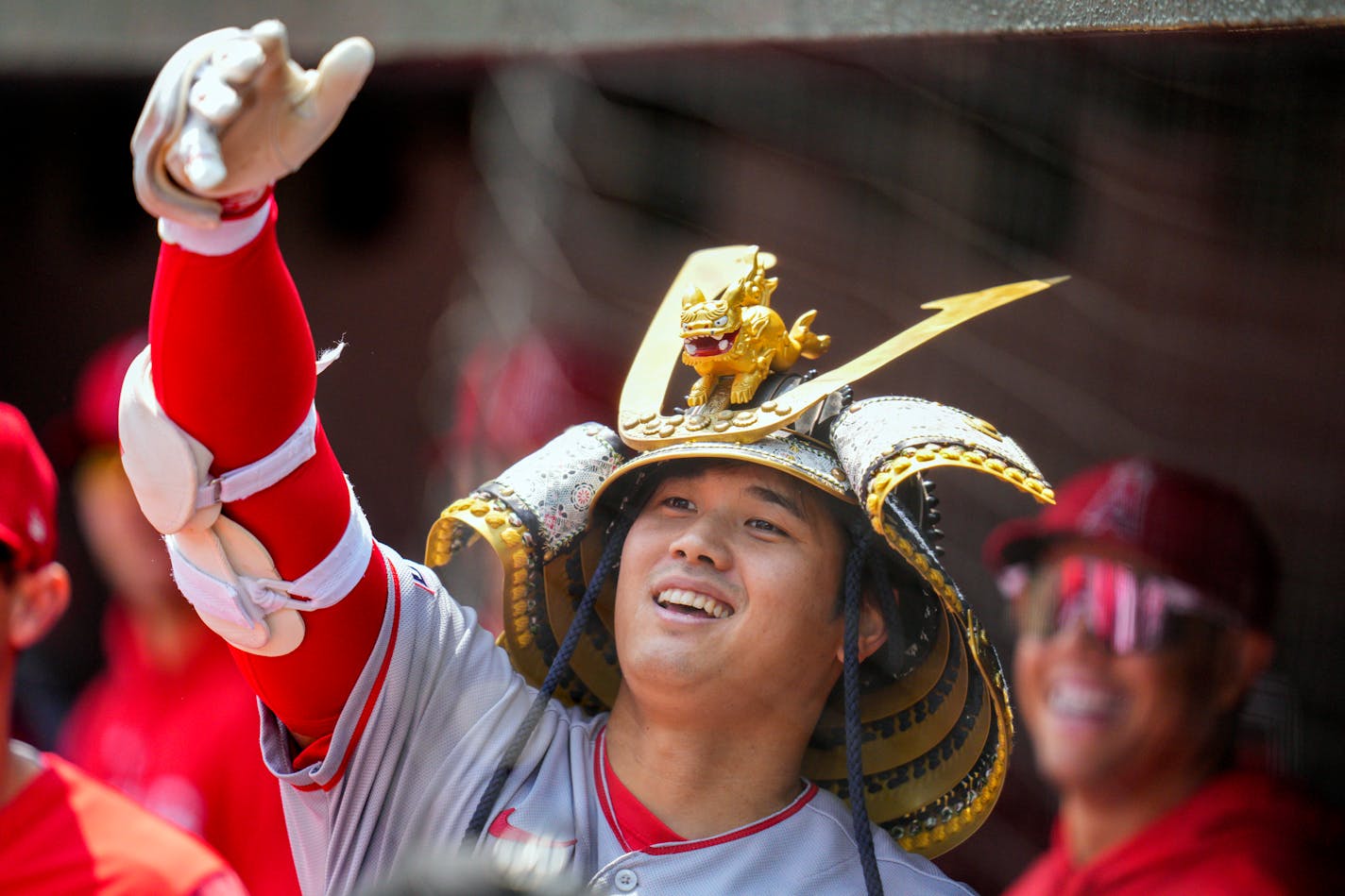 Los Angeles Angels designated hitter Shohei Ohtani celebrates in the dugout after hitting a home run against the Baltimore Orioles during the first inning of a baseball game at Oriole Park at Camden Yards, Thursday, May 18, 2023, in Baltimore. (AP Photo/Jess Rapfogel)