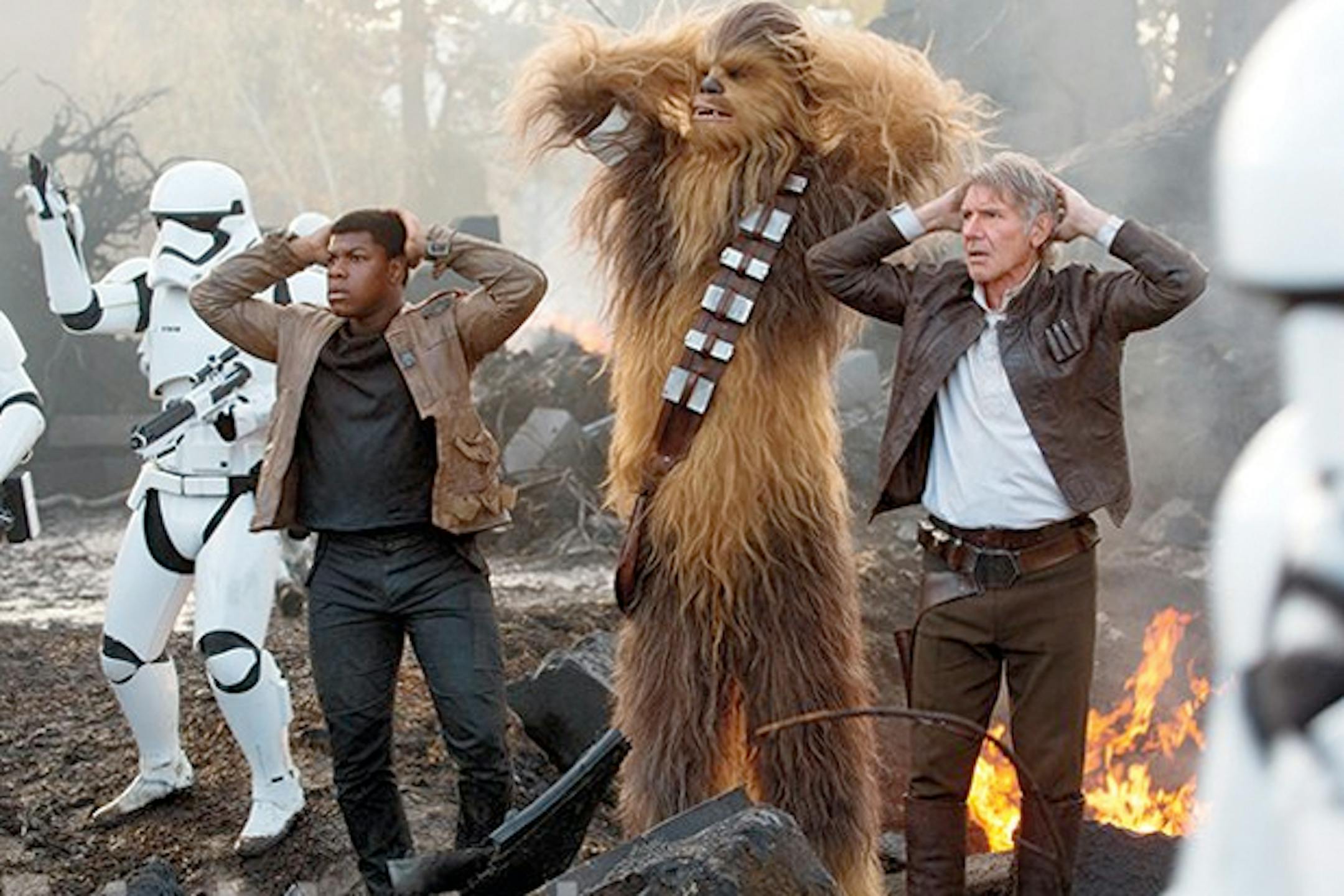 "Star Wars: The Force Awakens" stars, from left, John Boyega as Finn, Peter Mayhew as Chewbacca and Harrison Ford as Han Solo.