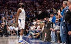Clippers guard James Harden looks up at the crowd during the second half of Game 4 against the Mavericks in Dallas on Sunday.