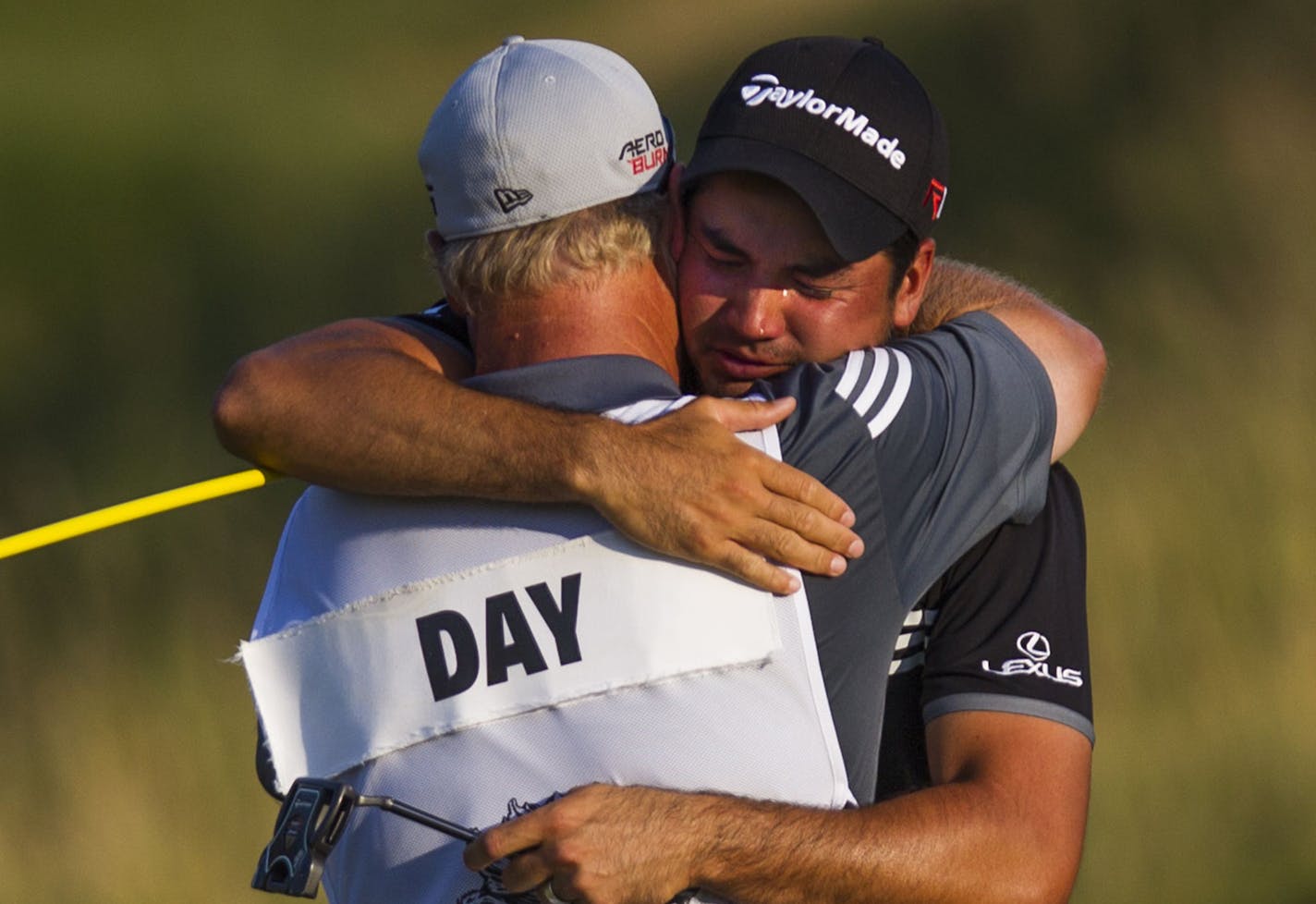 Jason Day hugs his caddie, Colin Swatton, after making par on the 18th hole and winning the 2015 PGA Championship on Sunday, Aug. 16, 2015, at Whistling Straits in Haven, Wis. (Katie Klann/Milwaukee Journal Sentinel/TNS)