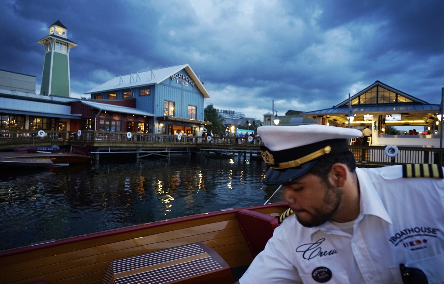 In downtown Disney at Steve Schussler's newly opened Boathouse, the restaurant is a high-end dinner destination which features the creator's triple threat: good food, entertainment, and an extensive gift shop .] Richard Tsong-Taatarii/rtsong-taatarii@startribune.com