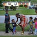 "I don't let them go outside anymore," said Darlene Evans as she takes a walk with her five youngest children on Wednesday, Aug. 12, 2015, in front of