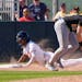 Willie Joe Garry Jr., shown here sliding into third base earlier this spring, played the hero for the Twins on Tuesday against the Phillies.