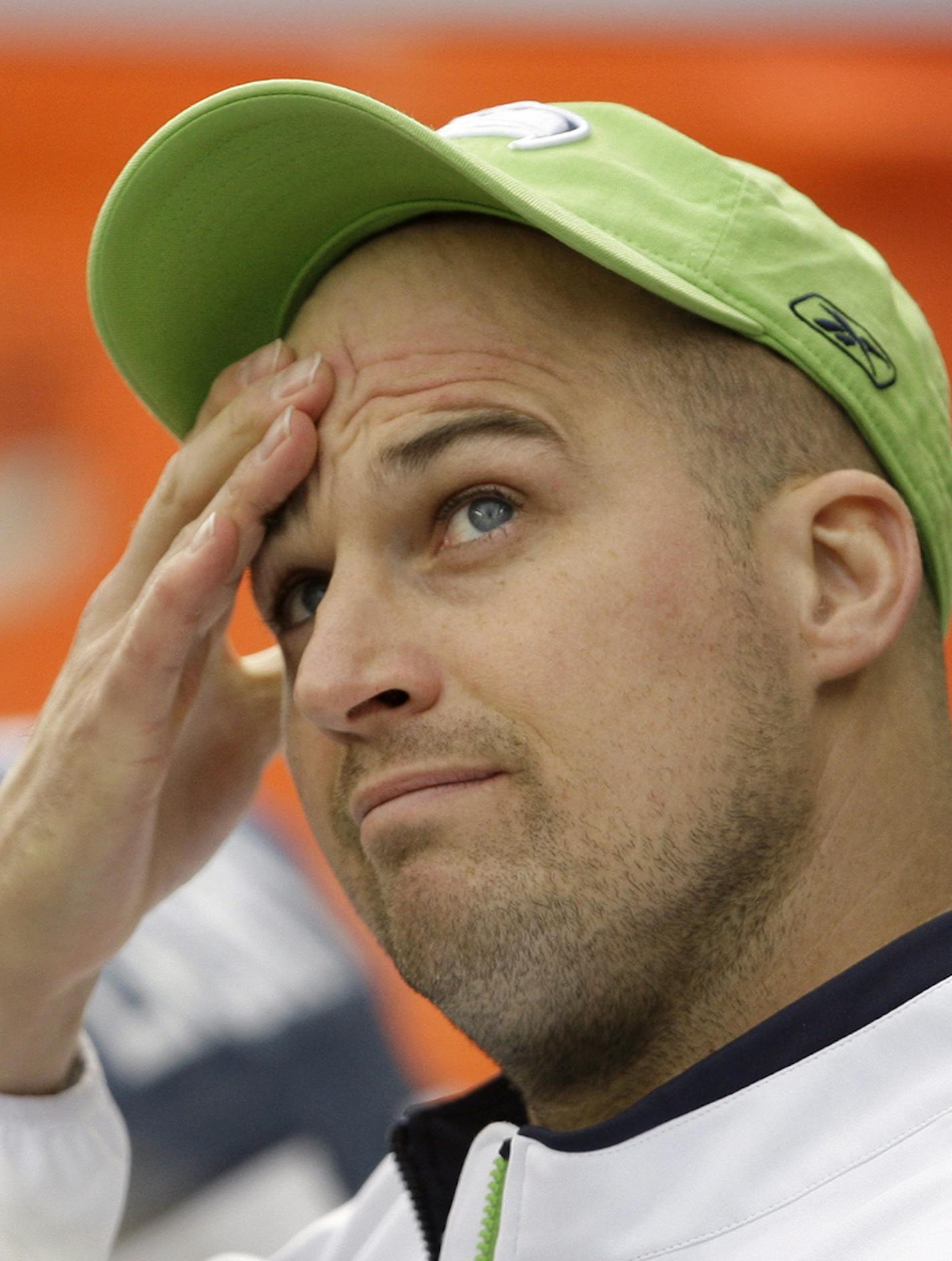 Injured Seattle Seahawks quarterback Matt Hasselbeck watches the final moments of an NFL football game against the Green Bay Packers on Sunday, Oct. 12, 2008, in Seattle. Green Bay won 27-17. (AP Photo/Elaine Thompson) ORG XMIT: SEA129