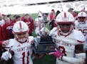 St. John's wide receivers T.J. Hodge (11) and Ravi Alston (3) celebrated after defeating St. Thomas earlier this season.