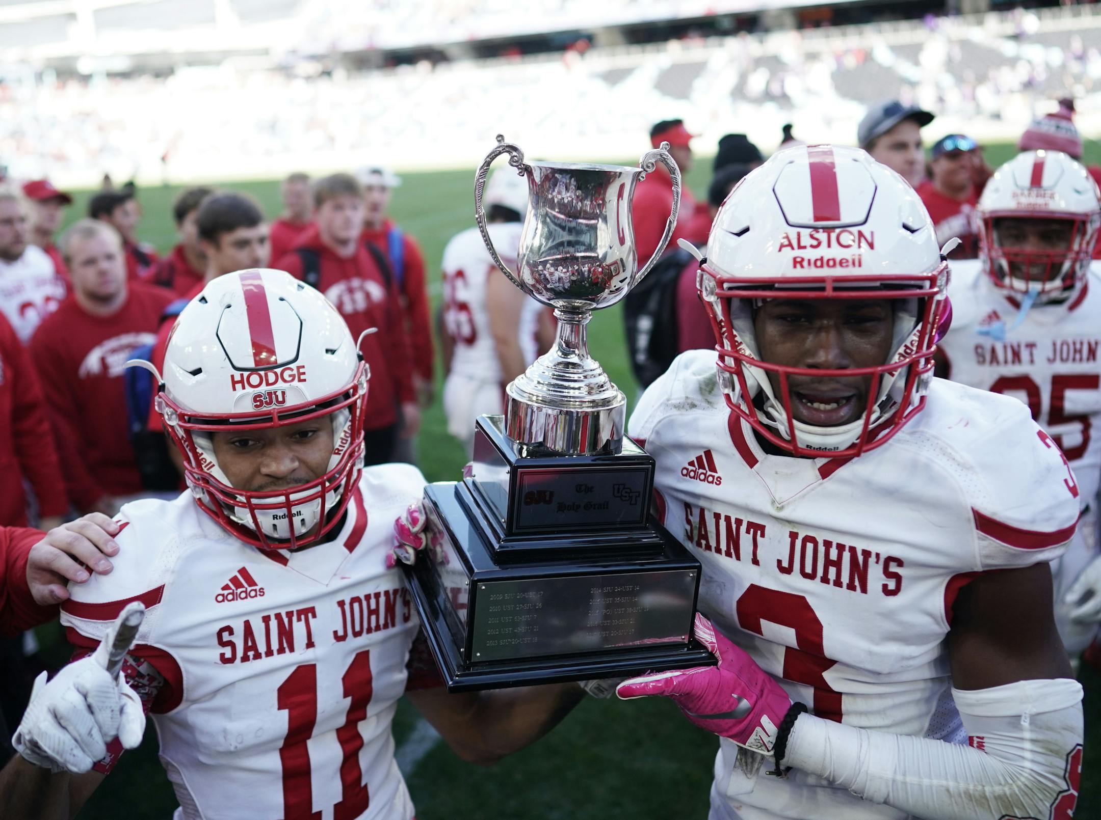 St. John's wide receivers T.J. Hodge (11) and Ravi Alston (3) celebrated after defeating St. Thomas earlier this season.