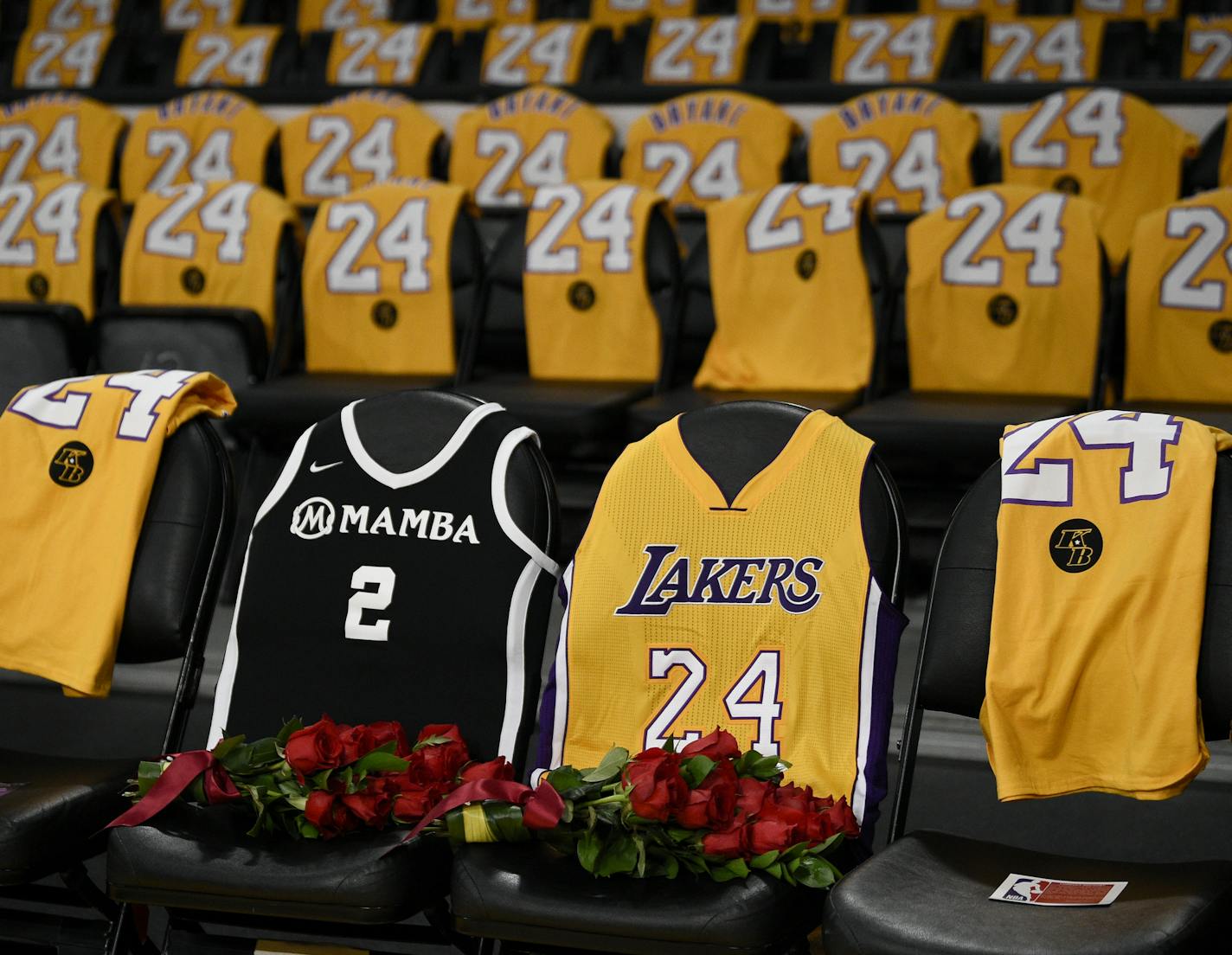 The jerseys of late Los Angeles Laker Kobe Bryant, right, and his daughter Gianna are draped on the seats the two last sat on at Staples Center, prior to the Lakers' NBA basketball game against the Portland Trail Blazers in Los Angeles, Friday, Jan. 31, 2020. The last game two attended was on Dec. 29, 2019 when the Lakers faced the Dallas Mavericks. (AP Photo/Kelvin Kuo)