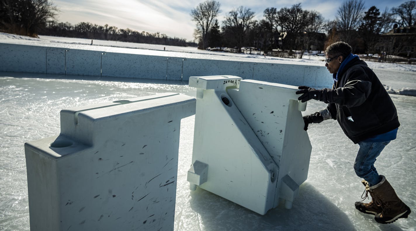 Alice Ferguson who works for Minneapolis Parks and Recreation put away the hockey rink pieces for the skating rink on Lake of the Isles in Minneapolis. "Calling it quits," she said about the weather dependent time when the rink barriers go back in storage.] Weather features from around Minneapolis and St. Paul RICHARD TSONG-TAATARII &#xa5; richard.tsong-taatarii@startribune.com