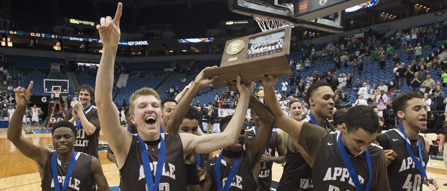 The Apple Valley Eagles head toward the student section with their championship trophy after defeating Champlin Park 64-61. ] (Aaron Lavinsky | StarTribune) Champlin Park takes on Apple Valley in the Class 4A boys' basketball championship game on Saturday, March 14, 2014 at Target Center.