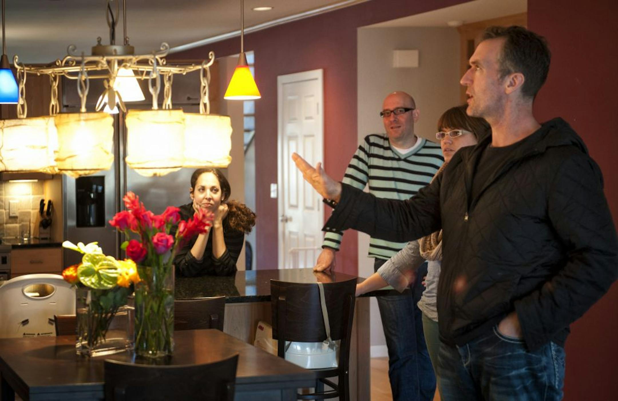 Jay Nuhring, right, of reSee Design helped Ben and Melanie Gray stage their Minneapolis home for sale. Jay's assistant Ashley Huebner is on the right. Friday, November 16, 2012.