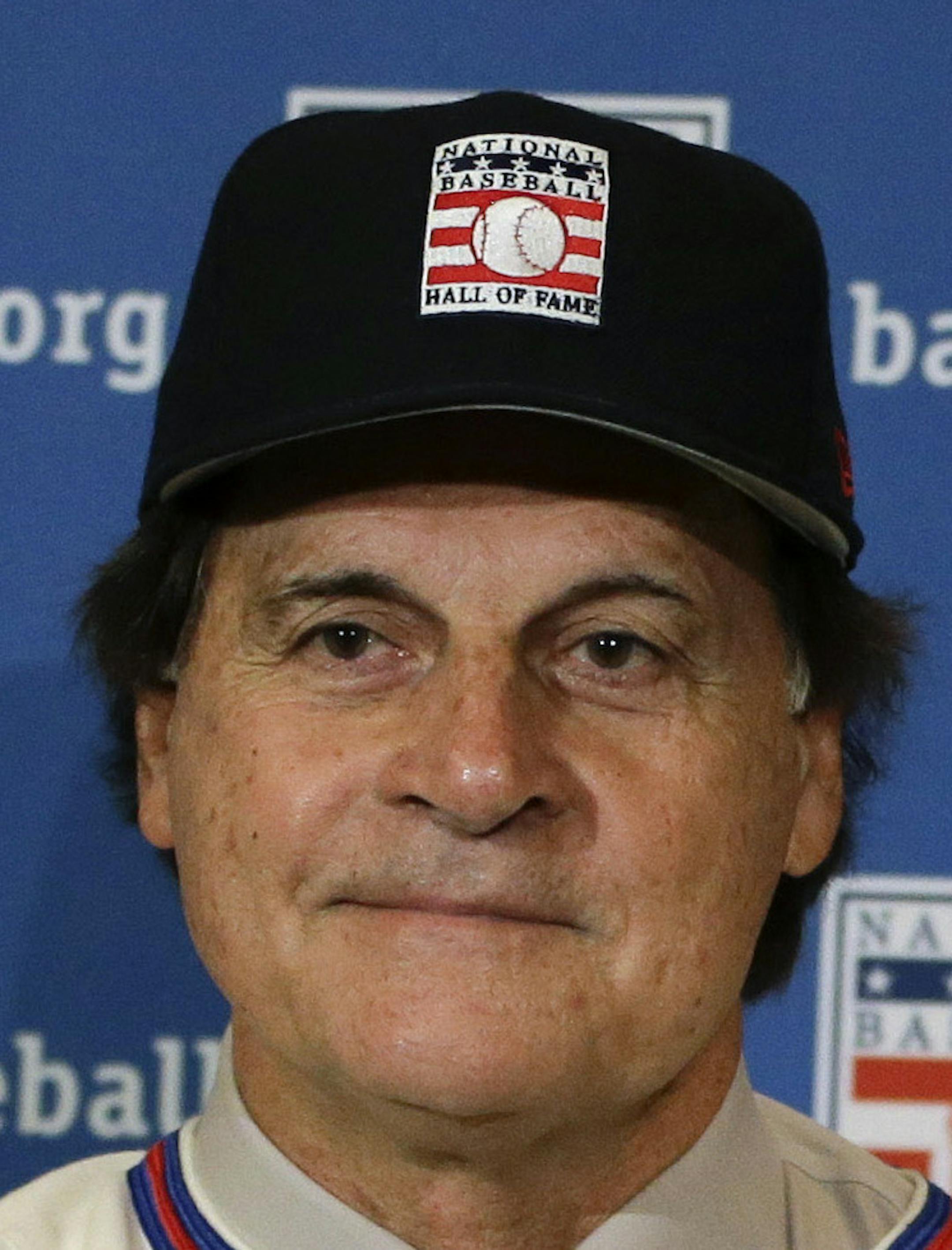 ADVANCE FOR WEEKEND EDITIONS, JULY 26-27 - FILE - In this Dec. 9, 2013 file photo, retired managers, from left, Tony La Russa, Joe Torre and Bobby Cox gather for a photo after it was announced that they were unanimously elected to the Baseball Hall of Fame, at a news conference during MLB winter meetings in Lake Buena Vista, Fla. Induction ceremonies are Sunday, July 27, 2014, in Cooperstown, N.Y. (AP Photo/John Raoux, File)