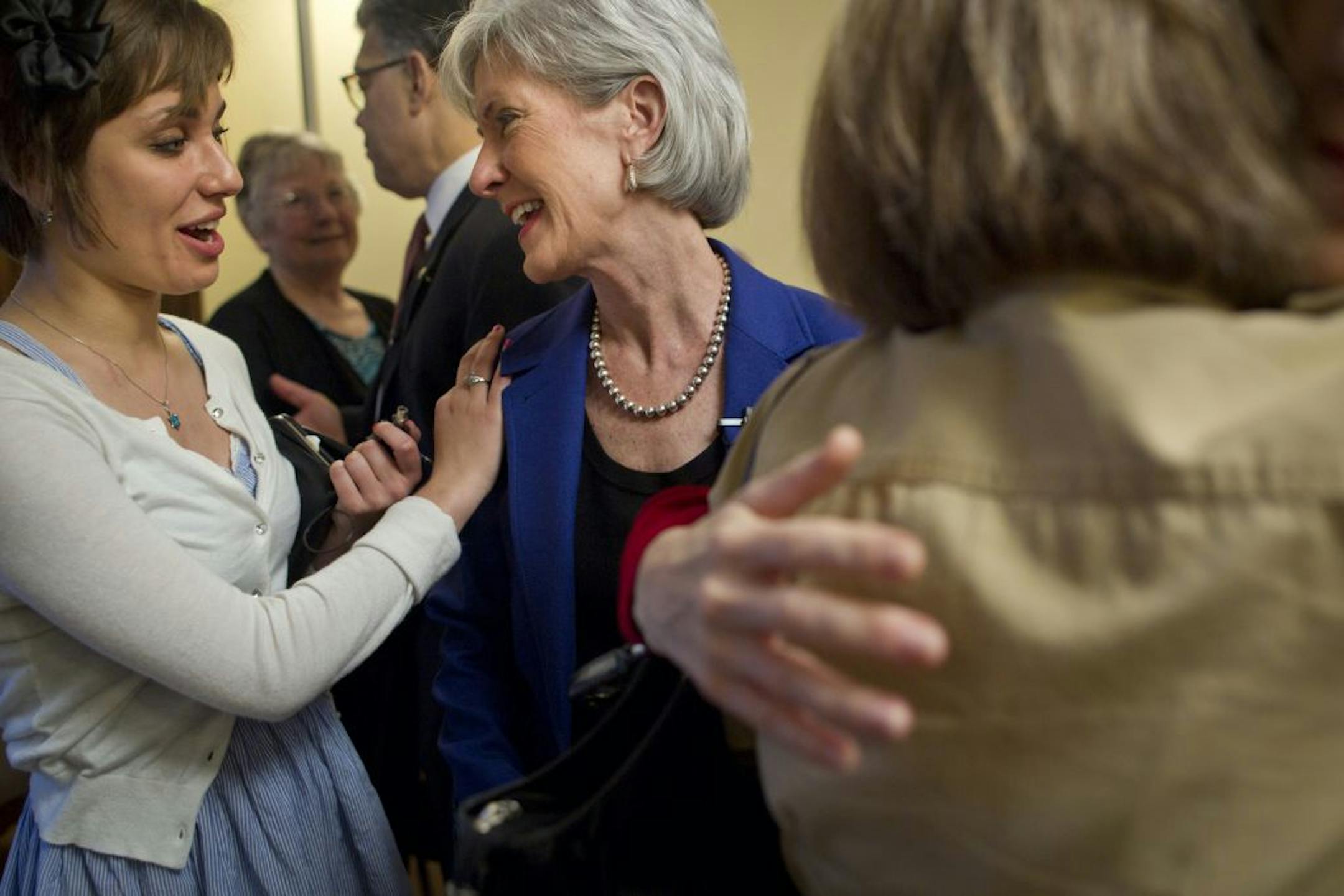 Abby Schanfield thanked Secretary Kathleen Sebelius after a discussion where Schanfield spoke of her congenital and chronic disease called toxoplasmosis that is a pre-existing condition and how healthcare reform has helped her. Secretary of Health and Human Services Kathleen Sebelius met with a group of women, along with Gov. Mark Dayton, Sen. Al Franken and Rep. Betty McCollum, at the home of RN Linda Hamilton for a discussion on the anniversary of federal health care reform on Friday, March 23