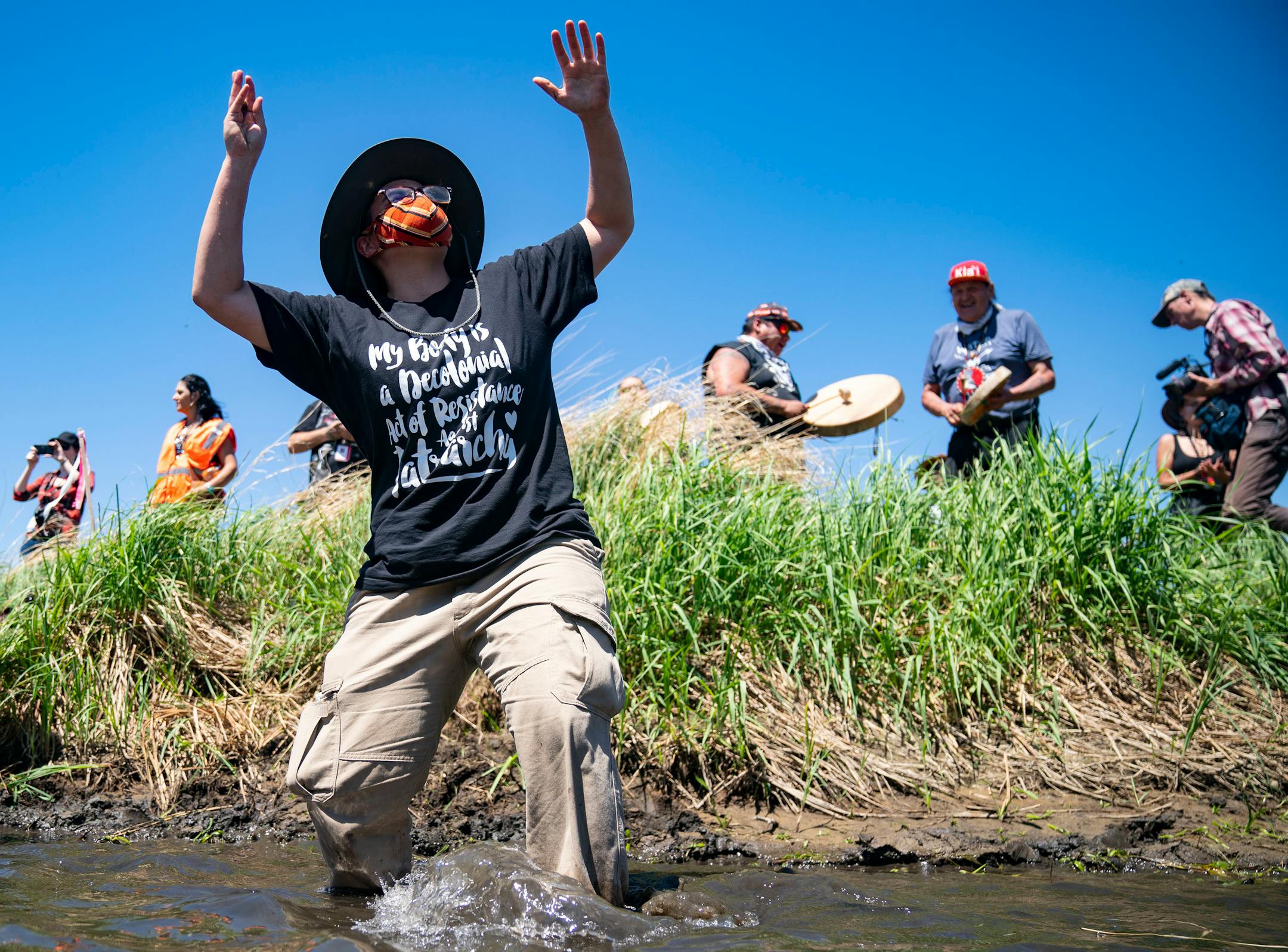Celeste Skyfire Knight danced to indigenous songs in the Mississippi River on Monday.