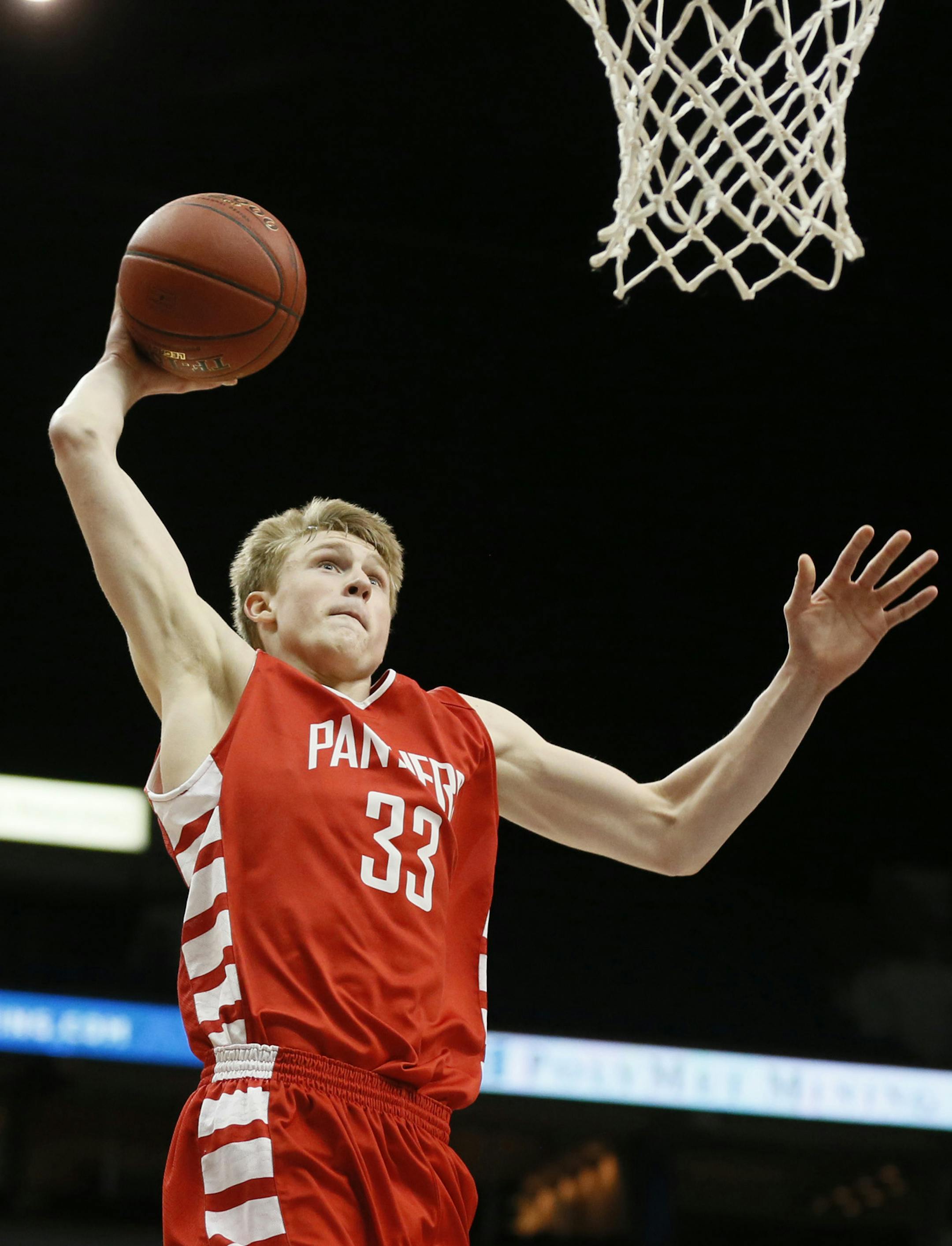 J.P. Macura of Lakeville North dunked over Sam Ortmann of Buffalo during class 4-A quarter final action between Lakeville North and Buffalo high school basketball at Target Center March 12, 2014 in Minneapolis, MN. Lakeville North beat Buffalo 59-57. ] JERRY HOLT jerry.holt@startribune.com Jerry Holt