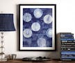 The framed indigo circles abstract giclee print was influenced by the Japanese concept of wabi-sabi or imperfection and impermanence, and the saturate