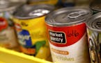 Cans were labeled and organized by expiration date. Chaska High School's "Hawk Haul" food shelf serves about 25 students weekly with its stock of cann